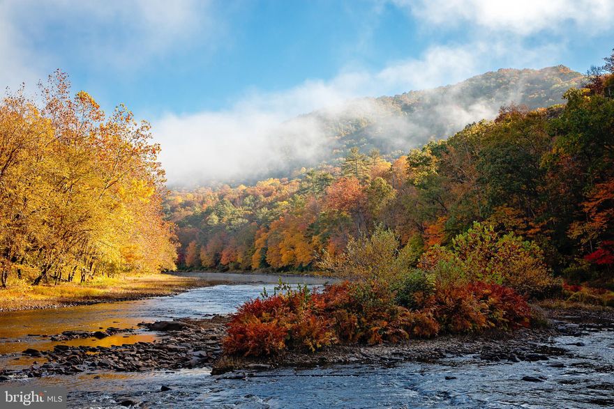 Nestled on 69 pristine acres, this former Girl Scout Camp is a nature lover's paradise with a myriad of amenities and a location that will leave you awe-inspired. Boasting a well-established and meticulously maintained internal road system, this property offers both convenience and tranquility. The 1,200 square foot home, which has been thoughtfully updated with modern amenities, serves as your cozy retreat in this idyllic setting. From the moment you arrive, you'll be captivated by the charm and comfort that the home exudes. Whether you're looking for a full-time residence, a weekend getaway, or a vacation rental, this property has it all. For those who appreciate the soothing sounds of flowing water, you'll be delighted to discover that this property boasts an impressive 1/3 mile of frontage on the Greenbrier River. The riverfront access provides the perfect opportunity for fishing, kayaking, or simply lounging by the water's edge. Enjoy picnics, bonfires, and all the joys of riverside living right in your own backyard. The breathtaking mountain views that envelop the property make a spectacular backdrop to enjoy all four seasons. Wildlife enthusiasts and hunters will find this property particularly enticing. Abundant wildlife roams freely in the area, making it a haven for nature enthusiasts. Whether you're an avid hunter or simply enjoy observing wildlife in its natural habitat, this property will not disappoint. Convenience is key, and this property offers easy access to Interstate 64, ensuring that you're never too far from the modern world when you need it. The town of Lewisburg, voted "2011 Coolest Smalltown in America" is also nearby, providing all the conveniences and services you might need. Outdoor enthusiasts will appreciate the proximity to the Greenbrier River Trail, a 78-mile rail trail that winds through some of West Virginia's most breathtaking scenery. Whether you're into hiking, biking, or simply strolling along this scenic path, it's a fantastic resource for enjoying the great outdoors. In summary, this former Girl Scout Camp is a remarkable piece of real estate that offers a blend of tranquility, natural beauty, and modern comfort. With its well-maintained roads, riverfront access, mountain views, abundant wildlife, and proximity to both the Greenbrier River Trail and Lewisburg, it's an opportunity to create your own oasis in the heart of West Virginia's wilderness. Whether you're seeking a private residence, a weekend escape, or an investment property, this unique offering is not to be missed. Embrace the charm of this property and let nature's wonders become a part of your daily life.