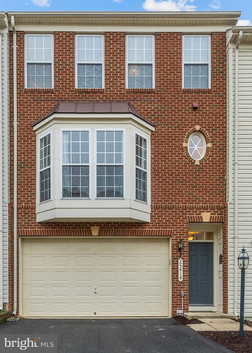Gorgeous townhome boasting a 3-level extension and over 2800sf of open and bright living space.  Freshly painted, and new flooring on the upper and lower levels.  The main level is perfect for entertaining.  Huge kitchen with tons of cabinets and counter space, two sided fireplace, massive living room, and a sun room that walks out to a new deck.   Upstairs, the owner's suite is spectacular.   Two walk-in closets, oversized bathroom, sitting area, and decorator touches.    The basement is perfect for relaxing.   Huge room to gather to watch tv, or head out to your fenced yard.  Oversized two car garage with custom storage.  Amazing neighborhood with tons of walking paths, pool, playground.