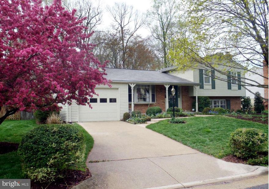 Light-filled, split level home features upgraded baths and kitchen with granite counters, breakfast nook, hardwood floors and more. Beautiful, fenced landscaped yard with two stone patios that backs to trees. Walk to schools, shopping, and public transportation. Enjoy all of Lake Ridge's amenities.