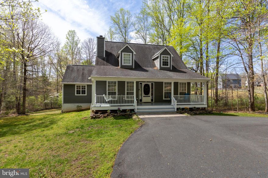 Welcome Home to 372 Daniels Road in Greene County! This gorgeous home offers an incredibly convenient location, just minutes to Route 29. Situated at the end of a cul-de-sac, you won't have to worry about passing traffic and can enjoy the peace and quite this wonderful property offers! You'll be greeted by a low maintenance paved, circular driveway as you pull up and this adorable Cape Cod with an expansive front porch offering plenty of space to relax! On one of the largest lots in the neighborhood, your home is surrounded by 1.24 acres, a sprawling yard, and not to mention, is bordered by a flowing creek. Step inside and immediately be wowed by the open, light-filled floor-plan! The main level boasts a large living room with vaulted ceiling, a gas fireplace, and gleaming hardwood floors. Continue through to the gorgeous dining room with interior columns that leads out to the rear screened porch and opens to the bright kitchen. The kitchen features a center island, tiled backsplash, stainless steel appliances, and vaulted beamed ceilings with recessed lighting as well as skylights. Additionally on the main level are 2 bedrooms, a full bath, and laundry hookups should you desire to have the laundry on the main level. Head up to the 2nd level where you'll have a bonus room with an overlook into the living room - perfect for a playroom, office, den, etc. The primary suite finishes the upper level and offers a huge walk-in closet and attached bath with double vanity and jetted tub. We're not finished yet, the fully finished lower level gives you even more living space! You'll find a rec room / family room, 2 additional finished rooms ideal for a home office &/or guest space; lastly are the expansive laundry / utility room and a half bath. Come see for yourself, you won't want to miss everything this fantastic home has to offer!