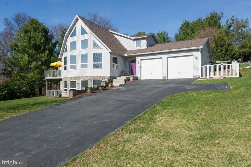 OPEN SUN 5/22,1-3:Stunning home includes soaring 20' ceilings in great room/kitchen/dining*first floor owners' suite with deck*a large den that opens to rear patio*a possible additional bedroom on first fl*3 bedrooms and a full and half bath that enters to loft overlooking great rm on 2nd fl*lower level includes a lg finished fm/rec rm, full bath and professional office w/ private ent*Poss in-law.