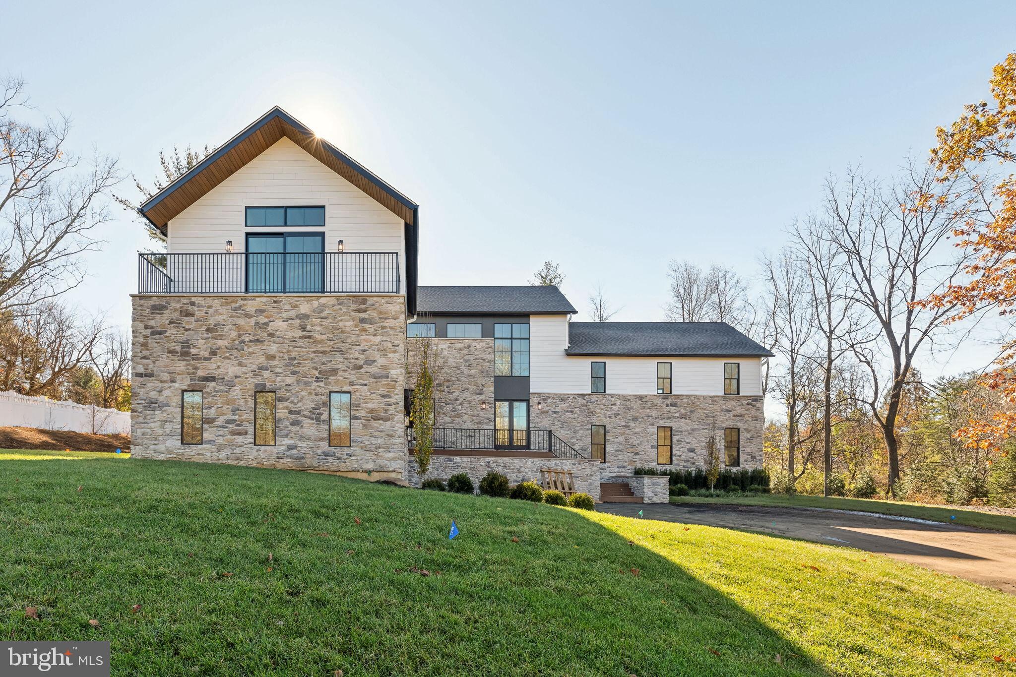 Now available in the prestigious Main Line area, Zatos Investments presents an unparalleled blend of sophisticated design and cutting-edge craftsmanship. 918 Ethan Allen is a brand-new single-family home that is the embodiment of refined luxury living. Spanning across 5,468 square feet of living space, this home is fully equipped with 5 bedrooms, 5 full/1 half bathrooms, massive 3 Car Garage with the opportunity for additional storage, and multiple manicured outdoor spaces. Located in the nationally ranked Tredyffrin-Easttown School District, this suburban oasis has been meticulously curated to promise a lifestyle where elegance meets innovation. Upon arrival, you will enter into the foyer area that leads directly into the expansive main living area. This area combines both the living and dining space. The gourmet chef's kitchen boasts white oak cabinetry, quartz countertops, tile backsplash, Wolf appliances, a spacious oversized island with room for barstool seating and tons of space to dedicate for separate dining and entertaining. The Butler’s pantry adds to the convenience of this stunning home, elevating your day to day lifestyle. Off of the kitchen you can find your mudroom, powder room, and follow the stunning white oak hardwood flooring into the open living area. With tons of natural light pouring in through the large, black stained wood PELLA Lifestyle Windows, this spacious living room is complete with high ceilings and a beautiful fireplace, making for a perfect atmosphere for entertaining and relaxing. Seamlessly flow into an additional living space/the covered rear deck that is complete with a pergola and an outdoor fireplace, creating an indoor-outdoor space to unwind and entertain. Head upstairs to the second floor of this stunning modern home and experience 5 spacious bedrooms all with ample closet space, 4 full bathrooms, dedicated laundry room, a loft area off of the staircase and finally the primary bedroom which features a full walk-in closet with custom shelving, spa-inspired bathroom with soaking tub, steam shower with bench, dual vanity sink with storage, and a terrace with room for seating overlooking the front of the home. This home is complete with a customizable walk-out living area and fully finished basement which both can be the perfect space for a home office, gym or can be used as an additional living space. 918 Ethan Allen is complete with a 3 Car Garage, 20 year roof warranty, 1 year builders warranty, 4 zone HVAC system, and zoning approval for a pool! Located in the heart of Berwyn, this neighborhood boasts a perfect balance between historic allure and contemporary convenience. Filled with tree-lined streets, highly ranked education institutions, a flourishing downtown that features boutique shops and diverse dining options. The easy access to public transportation, including the SEPTA rail line, ensures effortless connectivity to Philadelphia. In close proximity to local hotspots NECTAR, Autograph Brasserie, White Dog Cafe, the King of Prussia Mall, Edge Fitness, Orangetheory Fitness, ACME, Trader Joe’s & some of the best golf courses in the surrounding area, this home is truly in a perfect location. Schedule your showing today!
