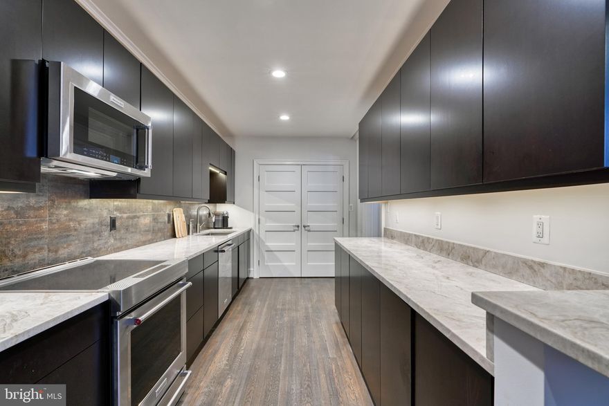 Welcome to your dream home in the heart of Mount Vernon! 12 E Mount Vernon Pl, Unit 2 is an exquisite 1-bedroom, 1-bathroom condo that seamlessly blends historical charm with modern luxury finishes, offering a unique and captivating living experience. Situated right on Mount Vernon Square, this condo offers a prime location just steps to shops, restaurants, major bus lines, transportation and more! 

Step into a beautifully designed space where every detail has been carefully curated. Featuring original hardwood floors, the open floor plan is perfect for entertaining guests and offers a large footprint. The designer-level kitchen offers sleek cabinetry, high-end stainless steel appliances, quartz countertops with a wrap around bar and a large pantry for all of your storage needs. The upper level also includes a half bathroom and access to the shared spaces in the condo. 

The bedroom and bathroom, located downstairs, provide a cozy and private retreat.  Not a single detail has been spared in the lower level. The bathroom offers a floating dual vanity, is fully-tiled and includes a large walk-in shower. The bedroom offers ample space for a king-sized bed and provides access to a true laundry room, a rarity in Mount Vernon. Offering a side-by-side washer/dryer, a folding bar, cabinet storage and a sink, the laundry facilities are some of the best in the neighborhood! Plus, the walk-in closet has been outfitted by Easy Closets to maximize storage space. Finally, all utilities are recently updated, making this condo completely worry-free!

Enjoy the best of both worlds with original architectural details that showcase the rich history of Mount Vernon, complemented by modern amenities that cater to your every need. 

Located in the heart of Mount Vernon, you'll find yourself surrounded by the cultural and culinary delights of this vibrant neighborhood. Explore historic landmarks, trendy cafes, and art galleries just steps from your doorstep.

This condo is not just a home; it's a lifestyle. Embrace the charm of the past and the luxury of the present in this unique Mount Vernon residence. Your dream home awaits – seize the opportunity to make it yours!