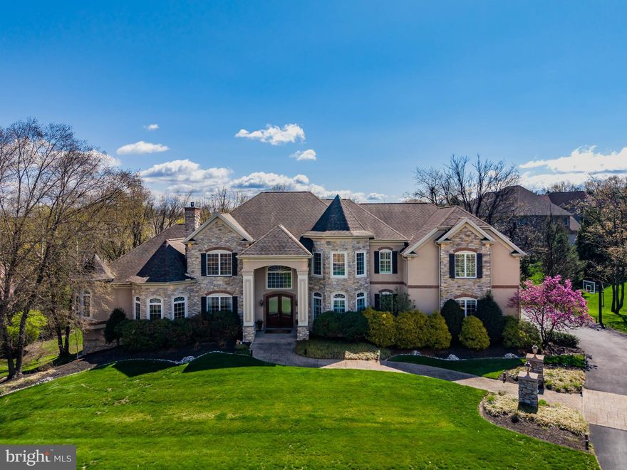 Welcome to this stately Roland-built residence in the exclusive Pinehurst Hills community, where elegance, thoughtful design and prime location converge. This architecturally distinguished home offers over-the-top luxury and functionality, beginning with a thoughtfully planned gourmet kitchen outfitted with top-tier Wolf appliances, a Sub-Zero side-by-side refrigerator, commercial-grade gas range, warming drawer, two-drawer dishwasher, beverage stations and a spacious walk-in pantry,  perfect for culinary enthusiasts and entertainers alike. The main level is anchored by a grand double-sided fireplace shared between the family room and terrace and another between the living room and executive office, creating warm, inviting spaces throughout. Custom woodworking, rich moldings, arched entryways, stone columns, and coffered ceilings add timeless character and detail.  All windows in the front of the home are wired for electric candles. The first-floor owners suite is a true retreat, featuring floor-to-ceiling windows, private terrace access, an expansive walk-in closet with custom built-ins, and a luxurious en-suite bath. Additional conveniences include a first-floor laundry room, mudroom and a side-entry 4-car garage. Upstairs, discover a possible second primary suite with full bath and dual sinks, a Jack-and-Jill bathroom connecting two bedrooms—each with walk-in closets and a third bedroom with its own full tiled shower. A second staircase off of the kitchen ensures easy access. The exposed finished lower level is an entertainer’s dream, complete with a home theatre room with projector and full screen, exercise or game room, full bath and additional storage. Enjoy outdoor living on the covered stone terrace with steps down to a built-in firepit and multiple seating areas,  framed by exterior lighting that beautifully enhances the home’s architectural features at night. Other notable amenities include 4-zoned heating and cooling, 2 water heaters, whole house hepa filtration system, sprinkler system, electric animal fencing, rain gutters have leaf filter protectors, an additional storage area w/ an exterior door in the basement for lawn equipment and a location that’s truly unbeatable in the heart of Hampden Township, just minutes from hospitals, highways, shopping, parks, and restaurants.