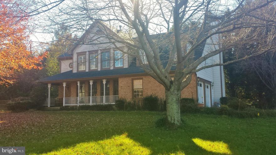 4 Bed 2 BA home features large kitchen w/ stainless steel appliances and custom cabinets. Plantation shutters throughout. Private screened in porch w/ raised ceilings and patio fan. Stay cozy by the fireplace with wooded view. Master bedroom has cathedral ceilings and two huge walk in closets with outdoor view.  Entertain in the family room located in the basement with custom wet ba.