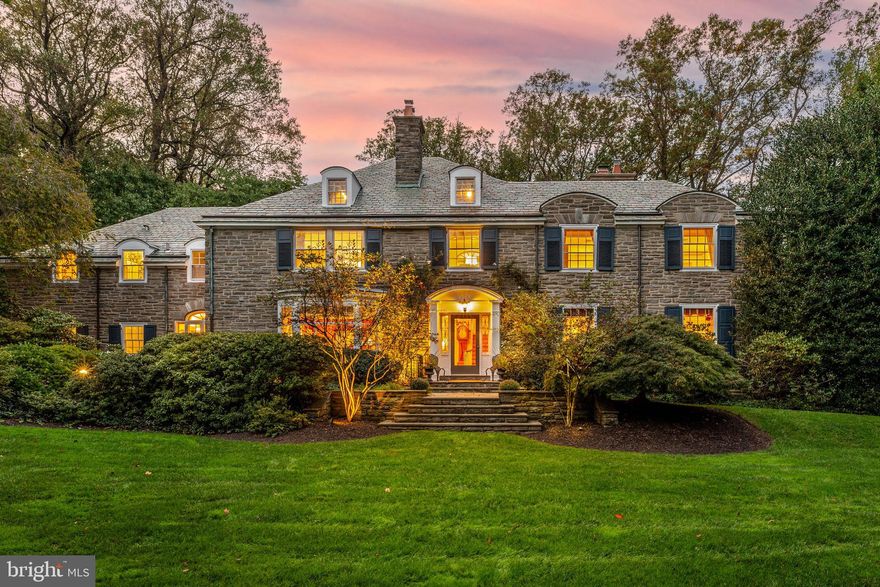 North Haverford treasure. Gracious stone estate perched on 1.5 lush acres on highly sought after Cheswold Lane. Idyllic neighborhood street in short walking distance to Merion Cricket Club, Haverford Town center, Haverford train station, shops, restaurants and the Haverford College Nature trail. A rare flat open yard is made utterly private by surrounding mature trees and finished with an elegant heated pool, positioned on the edge of a hilltop, overlooking the private wooded setting. Finished with slate roof and wrapped with flagstone patio and covered stone porches, this home offers wonderful opportunities for indoor/outdoor living. Large oversized windows embrace the pristine setting and bring glorious light throughout the home. Inside the timeless architectural detail, molding and fine materials have been elevated to modern day standards. A step down living room with soaring ceiling height is finished with fireplace, custom built-ins, oversized deep-silled windows and doors to the covered porch. The formal dining room with another bay window and beautiful molding also steps out to the covered porch. A large updated kitchen with center island overlooks the private backyard and is finished with a charming breakfast nook with beautiful french doors to the front terrace. The kitchen opens to a cozy den with fireplace and custom builtins. Upstairs, the primary suite walks out onto a large balcony overlooking the grounds and is finished with a sizable primary bathroom with tile shower, soaking tub and double vanity. A charming office overlooks the front yard and could incorporate nicely into the primary should one desire. This home boasts a very practical second floor floor plan with all five bedrooms and a laundry suite on the second floor. Step down the hallway from the primary and the first two additional bedrooms are sizable with large ensuite baths. Further down the hall two smaller bedrooms share a hall bath and can be closed off to form a private suite. A generous laundry room completes this floor. A large finished basement adds any needed extra living space including a large recreation room with fireplace, full bathroom, games room and space enough for a gym. Attached three car garage. Commuter's dream, convenient to major roadways for easy access to Center City, Philadelphia Airport, NYC and beyond. Also walkable or very short drive to Ardmore town center for trains to NYC or shopping at Suburban Square. Award winning Lower Merion School District.