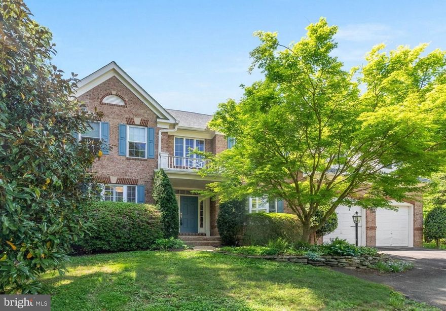 Welcome home to The Reserve at Martins Pointe! Situated in a quiet cul de sac, this three-level brick colonial is a picture of modern elegance with gorgeous updates! To the left of the grand two-story foyer you’ll find the sophisticated living room, with a wide picture window flooding the space with light. To your right, the spacious formal dining room features elegant crown and chair rail molding, and is generously sized for entertaining. Gleaming hardwood floors continue into the gorgeously renovated expansive kitchen (2022), boasting sleek granite countertops, a classic subway tile backsplash, and stainless steel appliances, including a desirable Bosch dishwasher (2019), double wall oven, and induction stovetop (2024). Pull up a bar stool to the beautiful oversized island breakfast bar, or take a seat in the bright and airy sunroom, surrounded by wall-to-wall windows as you sip your morning coffee. The exquisite family room on the back of the home features a dramatic high ceiling and a gas fireplace flanked by showstopping windows with a calm view of the backyard and sophisticated plantation shutters. This open concept floorplan makes this an excellent home for entertaining! Through double doors, you’ll find a perfect private home office. Upstairs, the extraordinary primary bedroom is a true retreat, with its own private and light-filled sitting room, plush carpeted flooring (2022), and massive walk-in closet. The generously-sized updated en suite bathroom (2023) boasts two separate vanities with granite countertops, a corner soaking tub, and an oversized step-in shower, with modern fixtures. Not to be outdone, the second bedroom boasts its own private attached bathroom and a wide closet, making it an ideal in-law suite or guest room. Two additional bedrooms both include soft carpeting (2022) and abundant closet space, with shared access to the third full bathroom in the hall. For your ultimate convenience, the large laundry room is located on the bedroom level and includes a pair of front loading high-efficiency washing machine and dryer (2020). Downstairs, the lower level of the home offers endless possibilities! With a private entrance, vast recreation room with newer flooring (2022), and stylish kitchenette, the fifth bedroom and fourth full bathroom provides you with the perfect opportunity for multigenerational living, a tenant, or live-in nanny! Several bonus spaces provide you with plenty of extra flexible room for a home gym, workshop, or playroom to suit your needs. Step outside onto your gorgeous brick patio to enjoy your lush and peaceful backyard. With beautiful landscaping, raised garden beds, a tree-lined surrounding, a fire pit, and a pond wired for lighting and a fountain, your fenced backyard is a fantastic private oasis for relaxing and entertaining. Major home updates include a new roof (2021), new gutters and gutter guards (2018), Ring doorbell and security cameras (2021), electric car charger (2018), interior and exterior speaker system, and dual zone HVAC with upstairs unit replaced in 2019. Located in the desirable Robinson school pyramid, you’ll be just minutes to Safeway, Giant, Target, Fairfax Corner, Fair Lakes Shopping Center, Fair Oaks Mall, Royal Lake Park and Trails, Pinn Community Center, and George Mason University. Quick access to the Burke VRE Station, Braddock Road, Route 123, Burke Centre Parkway, and Fairfax County Fairway to commute and travel around Northern Virginia with ease. This meticulously maintained home with all of these gorgeous updates won’t last long! Schedule a private tour of your stunning new home today!