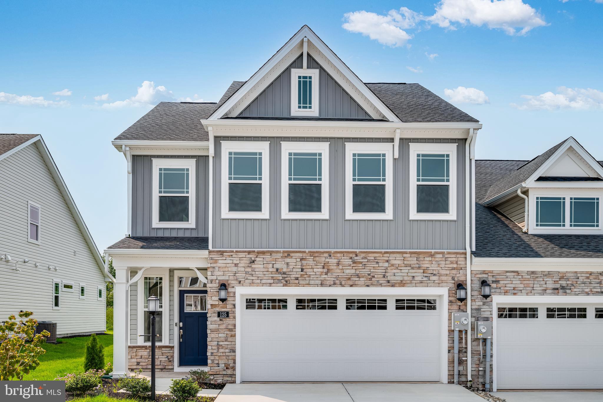 New Floor Plan - The Abigail - This Villa has 3 bedrooms, 2.5 bathrooms and a 2 car garage. Upgraded kitchen with granite counters, stainless appliances and generous kitchen island, super shower in owner's bath, finished walkout lower level, great for entertaining.