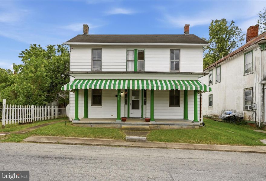 Investor opportunity just three blocks from downtown Charles Town. Set in a highly walkable location near restaurants, coffee shops, and local shopping, this older home offers a strong starting point for a full renovation project. Sold as-is and in need of a complete rehab, the current layout includes 3 bedrooms and 1.5 baths with a cellar for additional storage. The main level features a large living room, separate dining room, kitchen, half bath, and a laundry mudroom. Upstairs, the home is configured with 3 bedrooms, 1 full bath, and a bonus sunroom that could serve as an office, reading room, or flexible workspace. Public water and sewer are in place, and high-speed internet is available in the neighborhood. For buyers looking to restore and reimagine a home in the heart of Charles Town, the location is the story here.