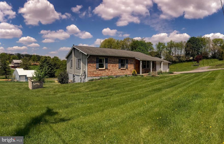 Well-maintained and updated 4-5 BR, 3 BA rancher perched on gorgeous 2-acre property offers fully finished basement w/possible separate living quarters.   Brand new deck overlooks fenced pasture and surrounding countryside.   Pole barn offers vehicle/tractor storage as well as 1 stall and tack room area, with room to add more stalls.  Barn offers run-in from fenced pasture,  electric and water, and fenced pasture has running water from a spring flowing through the property.  This would be perfect for your animals or for someone with lots of toys or equipment!  You will not be disappointed.