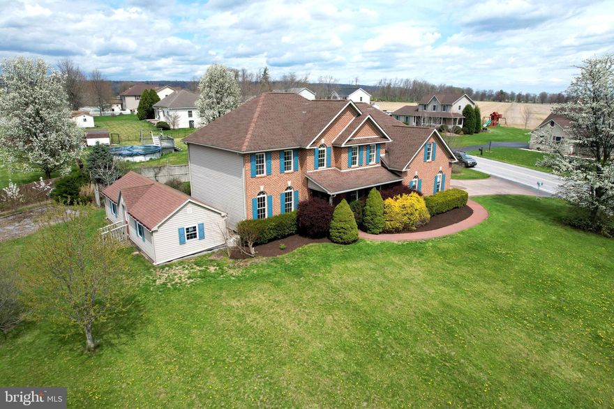 Robinwood Beauty! Set on a prominent .55‑acre corner lot in Robinwood, this stately brick front Colonial at 155 Lorinda Lane makes a striking first impression! This 4 BR 4BA home offers more than 3,200 sq ft of living space. Two story entry foyer flanked by living and dining rooms. Hardwood flooring in entry, dining room and family room. The large eat-in kitchen is truly the heart of this home. Granite countertops, plentiful cabinetry and a pantry closet, double oven and central island with prep sink. Kitchen has access to rear yard and is open to family room with gas fireplace flanked by large windows. An office which can be used as an additional bedroom and a full bath round out the main level. Upstairs, the large primary bedroom suite has two walk‑in closets and a spacious bathroom featuring a dual‑sink vanity, new LVP flooring, a jetted tub, and a separate stall shower. Three additional bedrooms, a full guest bath, and a well‑appointed second‑floor laundry room—with sink, cabinets, and folding space—complete the upper level. The lower level expands the home’s potential with a new full bath featuring dual sinks, a large unfinished area ideal for storage, hobbies, or future finishing, plus an additional sink and countertop area and a second washer/dryer hookup. Outdoors, the private backyard is a great place to relax, entertain or garden. A very large shed building provides excellent storage for outdoor equipment. With its classic brick exterior, grand interior spaces, and a location just minutes from Bellefonte, State College, and Penn State, this Robinwood property offers comfort, convenience, and room to grow. Homes in this neighborhood rarely come to market—schedule your tour today!
