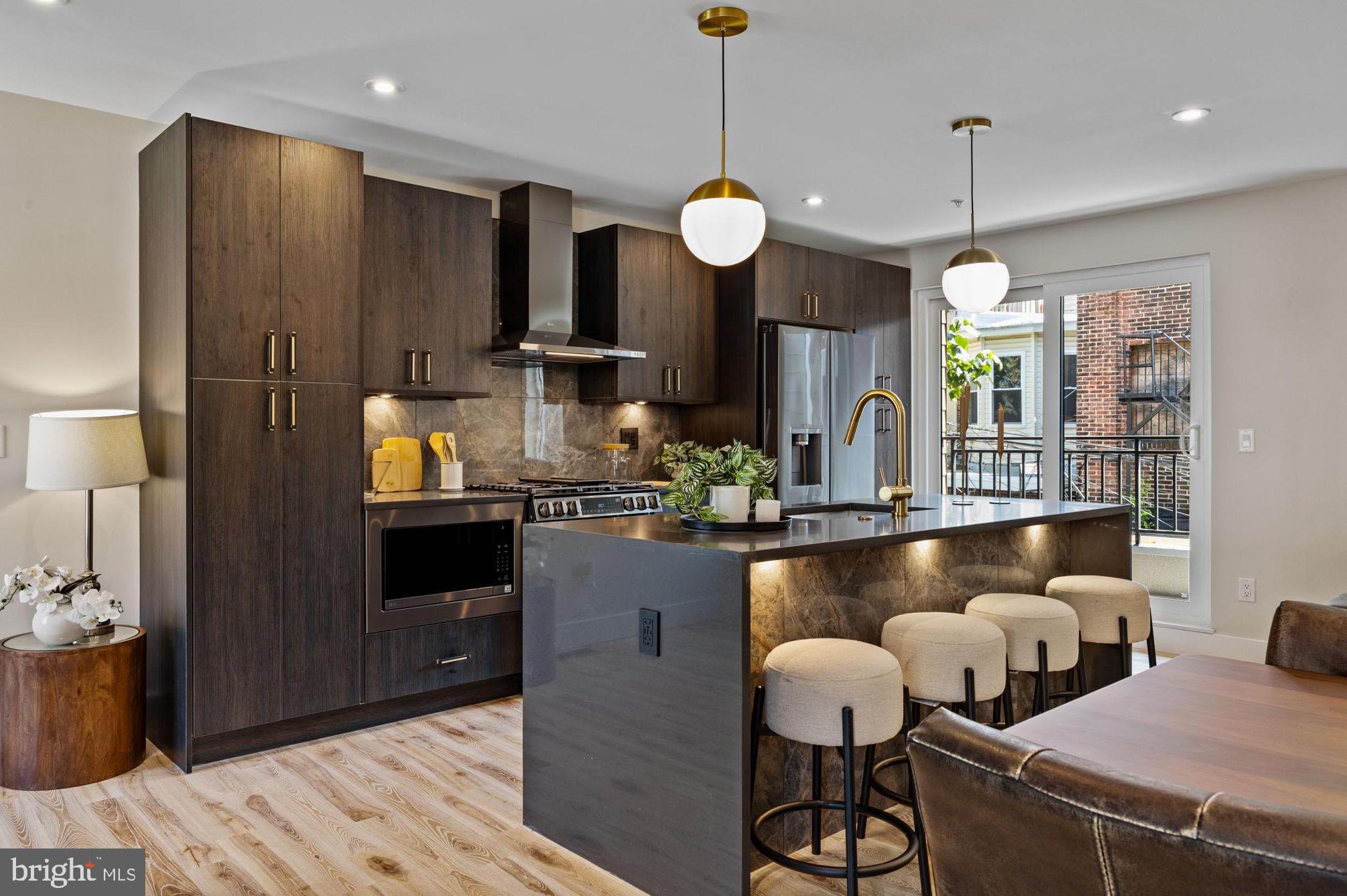 Introducing 2715 W. Flora Street! This luxury, new construction home impresses immediately with two-car garage, elevated finishes, and unparalleled views of Center City Philadelphia. On the entry level, 9 foot ceilings dominate the oversized two-car garage, storage closet, and interior foyer. (Garage is already prewired for a Level 2 EV charging station.)
On the main level, oversized windows and the first of three outdoor spaces greet you. A southern exposure immerses the residence with year-round natural light. The floating stairwell with glass partition brings light through the home. Hardwood floors. Upgraded kitchen. Oversized living and dining area. Tiled powder room on the main level for convenience.
The second floor is dominated by the primary bedroom suite. You'll love the laundry at the top of the stair for convenience. Ample room for a king-sized bed, big walk-in closet as well as a secondary closet, and a decadent primary bathroom with water closet, double vanity, walk-in shower, and soaking tub. Even better, there’s a private, second balcony in the primary bedroom as well!
Two additional bedrooms on the third level. Each room could serve a myriad of uses: guest or household bedroom, nursery, home office, or even home gym. Full bathroom with double vanity and shower/tub. Private balcony for third bedroom with city views. Wet bar at roof deck stairwell perfect for entertaining guests or a second coffee pot if you're working upstairs.
Of course, incredible Center City views from the 23-foot wide roof deck. It’s great in the daytime and even better at night. A short walk to Fairmount Park, Athletic Square, and around the corner from The Boozy Mutt, Baby's, and (soon-to-open) Human Robot.
Ten year tax abatement. Quiet, cobblestone street. Visit an open house this weekend or schedule your private showing today!