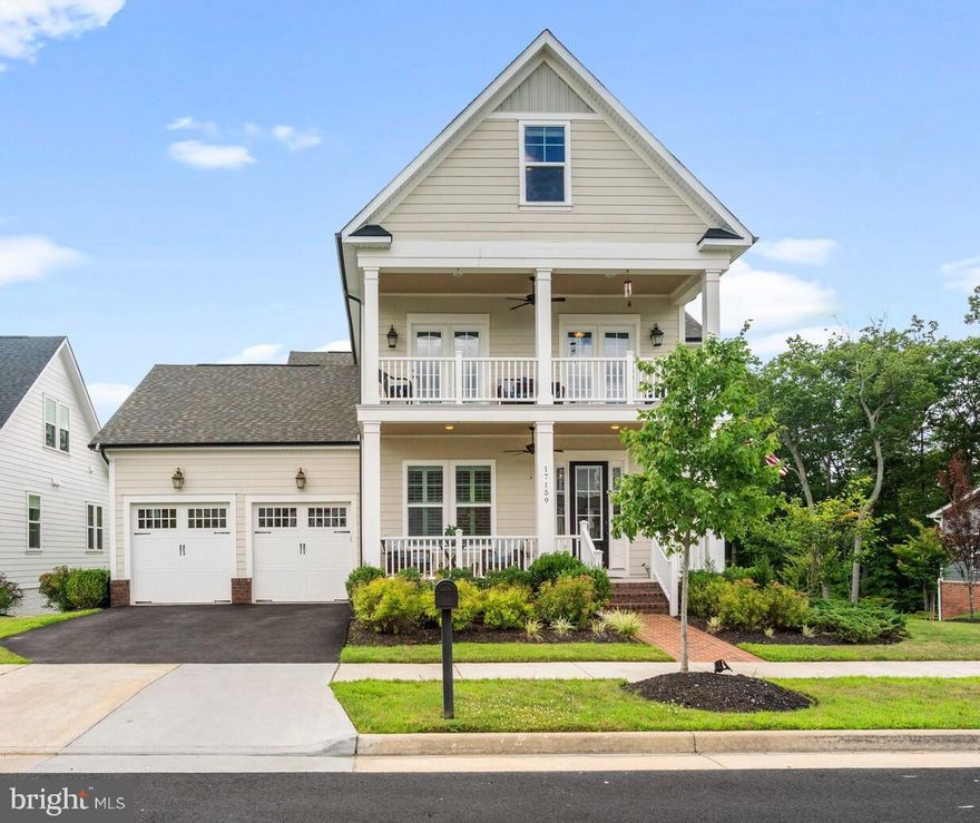 Homes like this are a rare find! Meet the Cape Henry! One of the original Potomac Shores Luxury Estate Homes built by NV. Only 5 of these were ever built and this is the only one with a loft. All 5 were built in 2014 and this is the first time one of them has become available for resale! 4 levels of exquisite Craftsmanship and high end finishes. Belle Isle Drive features 90ft wide lots, the exterior rim of which backs to conservation area and walking trails. This home welcomes you with the inviting charm of double front porches. Upon entering you'll find a greeting area with tray ceiling, built in bench and custom light fixtures. To your left is a study with built in book cases. As you follow the hall, this floor plan opens up to a formal dining area and flows into the family room with adjacent gourmet kitchen. Notice the abundant upgrades like plantation shutters, fan, the tidewater trim package, crown moldings, and custom fixtures. The family room connects to a custom deck overlooking the conservation area and large backyard.  On the other side of the kitchen you'll find a private hall leading to the basement, garage and a main level bedroom suite.  Multiple coat closets and a half bath round up the main level. Moving up to the second floor, you'll be greeted by a small foyer area. To your left is the amazing owner's bedroom with tray ceiling and a luxury spa type en-suite bathroom featuring dual vanities, dual walk-in closets, a private WC, linen closet, a soaking tub, and walk-though shower. This bathroom is worthy of being featured in a magazine! Another bedroom suite, a laundry room,  two additional bedrooms, each with access to the second story front porch, and a hall bath finish up this level. The third floor opens up to a sitting area that invites you to stay a while and leads to a 4th bedroom suite. On good days you may catch a glimpse of the Potomac River from this top level. In the basement you'll find a large recreation room with custom wet bar, an exercise room, a full bath, and a walk out to your back patio. A large unfinished area could be transformed into a movie theater. There is another unfinished area that houses the utilities and has lots of room for storage. Potomac Shores is home to a Jack Nicklaus designed 18 hole golf course, including a club house with restaurant. Current community amenities include an outdoor pool with 3 different zones, walking trails, canoe launch, club house with full kitchen, gym with varying classes,  community garden plots, and multiple play areas.  VRE station is scheduled to open in 2021/2022 and a town center development is underway. Potomac Shores is zoned for Covington-Harper Elementary School and a new middle school is currently under construction. John Paul The Great High School (private), a highly rated catholic high school, is located inside this amazing community. You'll also find multiple sports fields within the Ali Krieger Sports Complex. Community events include a Kentucky Derby party, 4th of July party, Fall Festival, Doggy Parade, and so much more! This home is everything you're looking for and more! Check out our open houses to take a look for yourself! Come see what all the fuss is about and join this community! Questions? Please reach out to Marion, the listing agent, I am happy to help!
