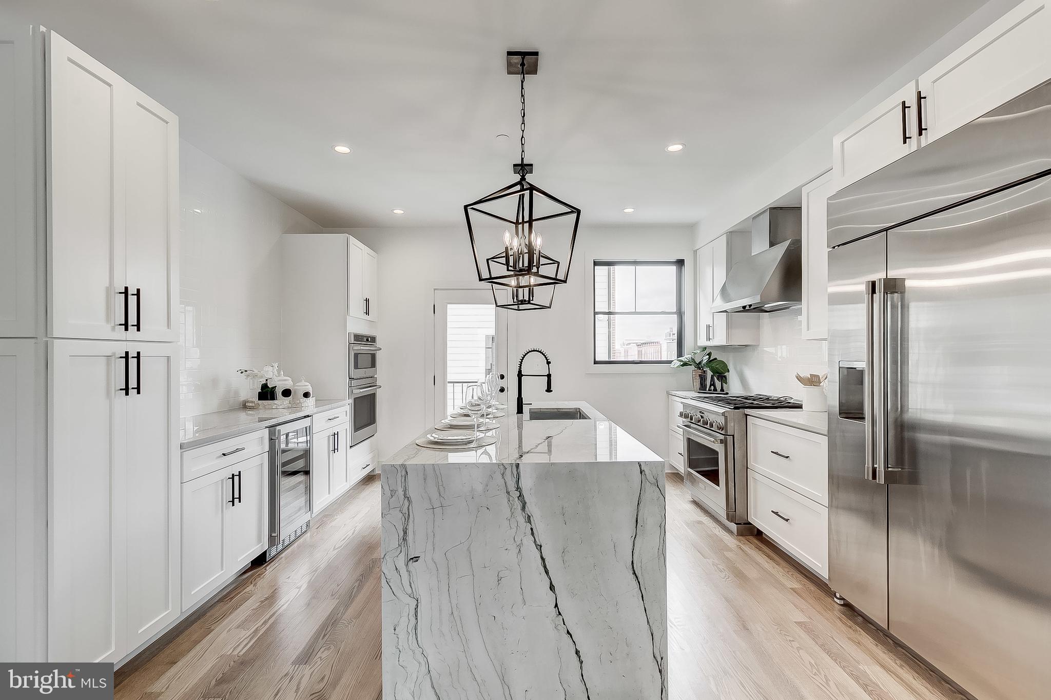 MODEL HOME IS NOW OPEN! NOW SELLING - FEDERAL HILL'S NEWEST 10 UNIT COMMUNITY - HANOVER CROSSING! 16+ FT WIDE BRAND NEW CONSTRUCTION CUSTOM HOMES WITH OVERSIZED GARAGE PARKING LOCATED IN THE HEART OF FEDERAL HILL. 5 YEAR NEW CONSTRUCTION/HIGH-PERFORMANCE TAX CREDIT AVAILABLE, SUBJECT TO DHCD APPROVAL. GLISTENING FINISHED IN PLACE HARDWOODS CASCADE THROUGHOUT. ENJOY CUSTOM SOFT-CLOSE CABINETRY, UPGRADED TRIM AND PAINT PACKAGE, IMPORTED TILE, DESIGNER LIGHTING, GRANITE/QUARTZ COUNTERTOPS, SS APPLIANCES IN DESIGNER CHEF'S KITCHEN. LOADS OF NATURAL LIGHT. 4 FINISHED LEVELS. 2,700+ SQ FT. HIGH CEILINGS. WALK-IN SHOWERS. WALK-IN CLOSETS. 4 OVERSIZED BEDROOMS WITH 4 FULL BATHROOMS. GORGEOUS BATHROOMS INCLUDE FRAMELESS GLASS SHOWERS AND RAINFALL SHOWERHEADS. EXPANSIVE ROOF DECK FOR ENTERTAINING WITH STUNNING VIEWS WITH WETBAR ON 4TH LEVEL. ENJOY SECONDARY OUTDOOR BALCONY OFF KITCHEN. BUYER TO TAX ALL TRANSFER TAXES. CLOSE PROXIMITY TO RETAIL SHOPPING, LOCAL DINING, AND ALL MAJOR HIGHWAYS. SCHEDULE A PRIVATE TOUR TODAY!