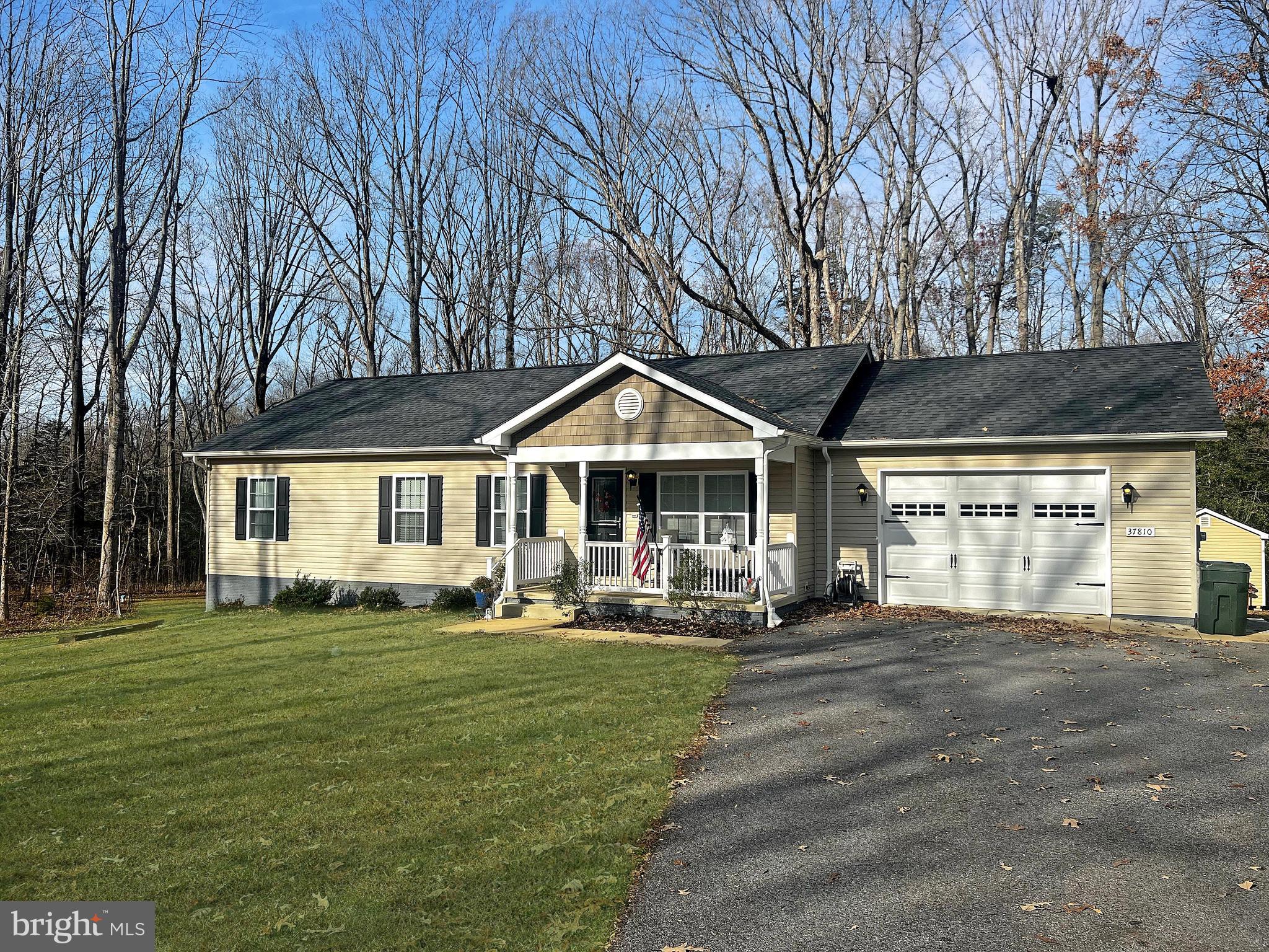 Sited on an expansive 2+ acre lot backing to lush forest conservation, this stunning retreat in the heart of St. Mary’s County is a standout! Built in 2018, this home is a beacon of modern elegance and thoughtful design. Step inside, and you'll be greeted by a practical and open floor plan that seamlessly connects every corner of the living spaces. Newly installed luxury vinyl planking graces the entire area, providing a contemporary aesthetic and easy maintenance. The heart of this home, the upgraded kitchen, is a chef's dream come true. Revel in the luxury of granite countertops, stainless steel appliances, and soft-close cabinets, offering both style and functionality for your culinary endeavors. Whether you're preparing a gourmet meal or enjoying a casual snack, this kitchen is sure to inspire. This retreat has three bedrooms, with the primary bedroom featuring a generously sized closet and a private bath. The second bath offers dual sinks, enhancing the convenience and comfort of daily living. The main level also hosts a spacious laundry room, complete with a utility sink, making chores a breeze. Recent improvements include new luxury vinyl plank flooring throughout (2024), washer and dryer (2019), large storage shed (2021) and more. Outdoor enthusiasts will relish the proximity to the Chesapeake Bay, community parks, rivers and forests perfect with endless recreational activities for everyone to enjoy. Savor the quiet peacefulness of rural living in this charming community while still being convenient to Washington D.C., Annapolis and Baltimore.