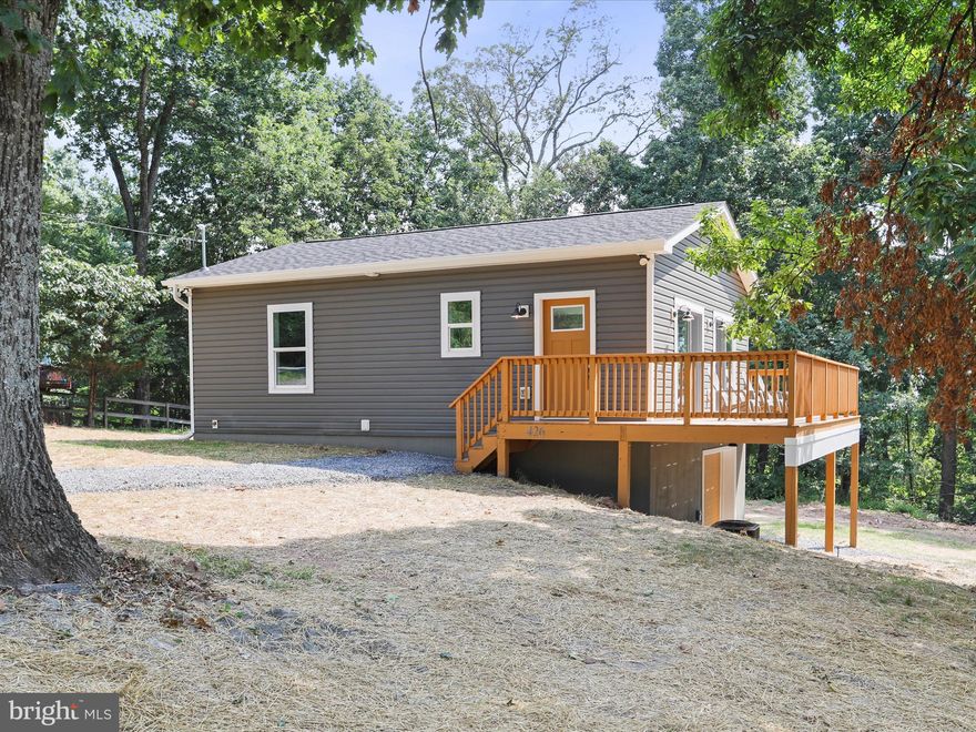 Welcome in to South County Ventures' new construction project.  This top quality build is situated on a 1.06 acre, mostly level lot featuring 2 bedrooms + 1 full bath as part of its open concept floor plan.  The home was constructed using stricter Washington County, Maryland codes by all licensed West Virginia contractors.  When planning the position of the foundation, it was important to take full advantage of the wow worthy views of North Mountain all while enjoying your full width wraparound deck.  On a clear day, you'll catch a glimpse of Washington County's South Mountain.  

The main living area includes cathedral ceilings, recessed lighting, LVP flooring, wood cabinetry with soft close doors/drawers, Whirlpool stainless appliances + quartz countertops.  As you venture back the hall, you'll enter the full bath with a fiberglass tub/shower combo, LVP flooring, soft close vanity + modern farmhouse lighting.  The 2 main level spacious bedrooms include comfy carpets + ample sized bump-out closets.  

The rancher's full unfinished lower level (13 course high, solid poured, concrete block foundation) allows tons of room for future expansion including a 13' x 24' family/rec room with rough in fireplace/wood stove, rough in for a full 3 piece bath + laundry area (hook ups are complete).  Once you would finish the lower level, your total square footage is just over 1300.  

There's more...a lower level, roll-up garage door storage area (14' 10" x 12' 9") is perfect for storing your ATV/UTV, kayaks + lawn tools/equipment.  Other noteworthy features - 200 AMP electrical service, 2 x 6 exterior construction, well - 25 GPM, low E windows/doors + HVAC (supply vents for lower level complete).  Super low HOA fee allowing access to community/private lake, baseball field + covered pavilion.  Close to Devil's Nose hiking trails/Sleepy Creek Wildlife Management Area + minutes drive to The Woods Resort golf courses.