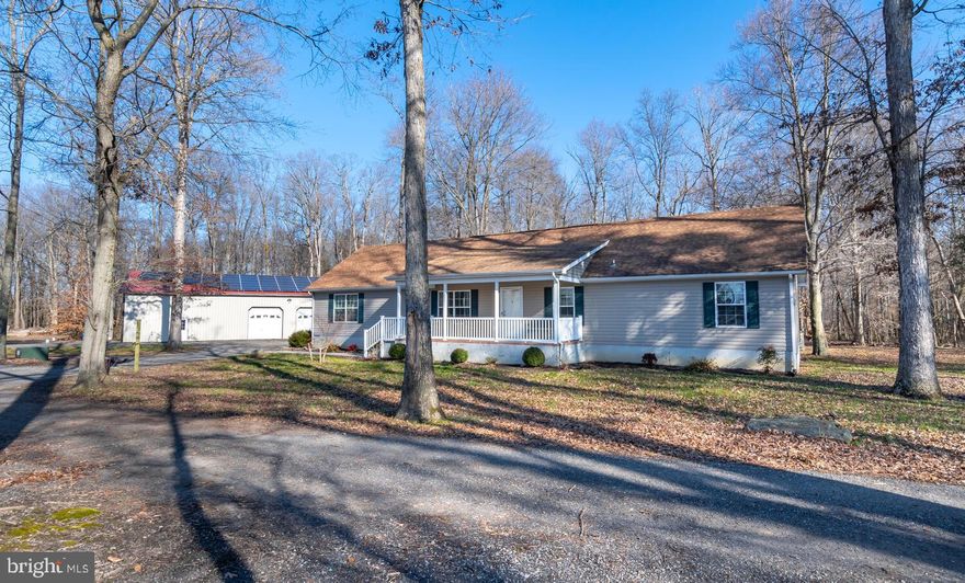 Spacious well maintained rancher on 6+/- acres with  40x60 Shop with 2 lean-to's, concrete floors and man cave, the home features an open plan design with space to relax and entertain guests, 3 bedrooms, 2.5 baths, kitchen with large island/breakfast bar, dining area, living room, family with fireplace, office (could be 4th bedroom), laundry/mudroom, front porch and back patio.  Make your move before someone else does.