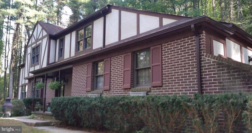 Outstanding opportunity to purchase this home tucked away in the woods with tons of privacy! This 3 bedroom 2.5 bathroom home has a 2 car garage + a plenty of space to park in the driveway.  The rear deck is huge and partially covered, perfect for entertaining. This house is livable the way it is but will look even better when you make a few updates.  The unfinished lower level is great storage or could be finished for more living space. New HVAC and hot water heater. Home being sold As-Is.