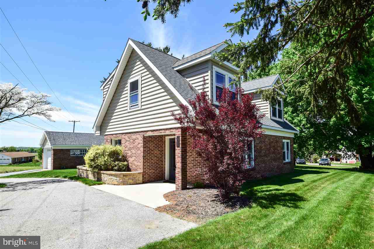Dazzling, completely renovated Cape Cod is surprisingly spacious & boasts premium upgrades thruout, incl open, fully accessible 1st fl layout w/ woodstove & stone tile hearth in LR, custom Kit w/ Jenn-Air appliances & B-I dining area, handmade cabinets & woodwork, recessed lighting, ceramic tile Kit & BAs, huge MBR w/ B-I dressers, window seat, W-I closet. Beautiful patio w/ rural views & raised garden bed, detached garage & more! Not a drive-by!