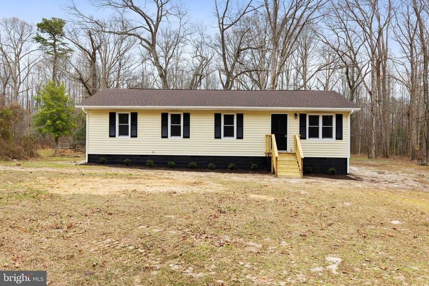 Welcome to your serene countryside retreat! This fully remodeled ranch-style home, nestled on 2 acres of tranquil land, combines modern comforts with rustic charm. Every detail has been meticulously updated, ensuring a move-in-ready experience. This home is set back from the road, allowing for a wide open and flat front yard space. You will enter the home into the family room, which has an open layout to the kitchen with all new appliances, granite countertops and brand new white cabinetry. New LVP flooring is throughout the entire home. Down the hall is a full sized laundry room and all new full hall bath with all new fixtures, tub, and vanity. The primary bedroom is at the end of the hall with a modern appointed full en-suite bath with walk in shower. There are THREE additional bedrooms in this home - all functionally sized with ceilings fans and usable closet space. Off the back of the home is a refurbished deck overlooking a spacious backyard and multiple outbuildings, perfectly suited for a variety of uses such as a workshop or animals. The expansive 2-acre lot offers endless possibilities for gardening and recreation. Major systems, including  HVAC, plumbing, and electrical, have been newly installed or updated to provide peace of mind and energy efficiency. This property offers the perfect blend of modern living and country charm. Whether you're looking for a peaceful retreat or a place to create lasting memories with family and friends, this home is ready to welcome you. Don't miss the opportunity to own this beautiful home in a picturesque setting. Schedule a viewing today and experience the tranquility and comfort this property has to offer.