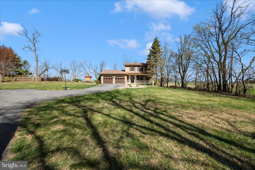 Set on over two acres of picturesque countryside, this beautifully maintained Colonial offers the perfect blend of privacy and modern updates. A private, tree-lined drive welcomes you home to a solidly built residence featuring a bright, updated kitchen with freshly painted cabinetry, quartz countertops, stainless steel appliances, and new flooring—all opening seamlessly to a comfortable family room.  Enjoy entertaining in the separate dining room and living room, and unwind in the spacious primary suite complete with a beautifully renovated bath. Two additional bedrooms share a stylishly updated hall bathroom, and brand-new carpeting adds a fresh touch throughout the upstairs. The walkout lower level offers endless potential, ready for your personal finishing touches. Step outside to a stunning screened-in porch where you can relax and take in the peaceful, scenic surroundings. Private, serene, and move-in ready—this is country living at its finest with low taxes and no HOA.