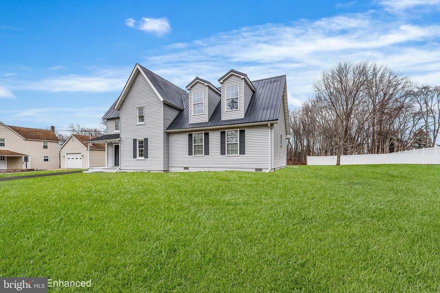 Welcome to this beautifully remodeled 1910 Colonial set on a spacious 0.5-acre lot in the sought-after Queen Anne school district. Offering 2,114 finished square feet across two levels, this home blends timeless character with modern upgrades throughout.

Completely renovated in 2025, the home features a durable metal roof, new HVAC system, fresh paint, updated lighting, and all-new bathrooms. The stunning kitchen showcases white shaker cabinets, quartz countertops, stylish backsplash, and brand-new appliances including refrigerator and stove. A convenient combination kitchen/dining layout makes everyday living and entertaining seamless.

The entry-level bedroom provides flexible living options, while the lower-level laundry area offers washer/dryer hookups. Flooring throughout includes ceramic tile and laminate plank for both beauty and durability. The primary bath boasts a luxurious new soaking tub, custom tile work, quartz vanities, and a beautifully finished quartz shower.

Outdoor features include inviting porches, a newly installed fence, shed for additional storage, and play equipment with designated play area. The home sits on a block and pillar/post/pier foundation and offers off-street parking.