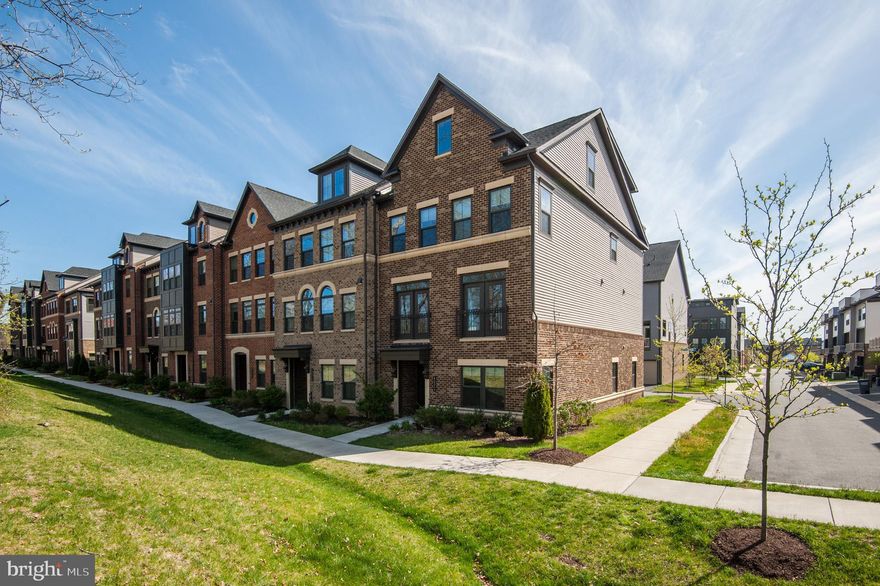 Within walking distance to all community amenities, offering convenience & accessibility to much of the Washington DC with Ashburn Station METRO! 4 Level TH w/ terrace showcasing an appealing modern design. First floor hosts a full bedrm w/ full bath. The heart of this home is the second floor, which features an open-plan layout w/ dining areas, gourmet kitchen, great rm & a large deck. Three bedrooms including the owner's suite are situated on the third floor. Fourth floor incudes a loft, a bedroom w/full bath, & a terrace that enhances outdoor enjoyment | Attached humongous 2 car rear garage w/opener | Washer & Dryer @ bedroom level | Easy access to upscale dining, shopping & recreation including Dulles Landing, Dulles Town Center, Tysons Corner Center, & Loudoun Station. Excellent access to Dulles Toll Road/Rt. 267, Route 7 and Route 28 | Excellence in style, function & location