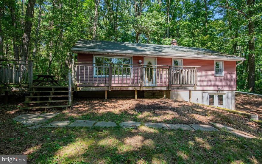 ''Ranch in the Woods'' This is a 3 bedroom 1 bath home with lots of potential. Updates needed. Many of the rooms have hardwood floors. It is an ''As Is Sale''