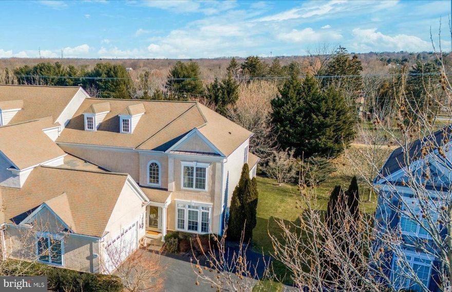 Welcome to 371 Primrose, a BEAUTIFUL HILLCREST MODEL in the RESERVE AT GWYNEDD with a 1ST FLOOR PRIMARY SUITE.  Where to begin - the open flow of this house and the windows everywhere will have you falling in love as soon as you walk in. The home itself was just painted through out and beautiful hardwood has been added. Now the whole first floor is hardwood including the Primary Suite. Also the upstairs hall way, flex room and one of the bedrooms are now hardwood. You will be struck by the gleaning hardwood foyer flanked by the impressive curved stairway to the second floor - it is spectacular. Off the foyer is a beautiful dining room with 4 oversized windows with transoms to let the light pour in. There is a two-story great room with a gas fireplace. This room flows into the kitchen with loads of 42” cabinets with under cabinet lighting and granite counter top. It even has a hidden “garage” for hiding your extra appliances. The kitchen flows into the breakfast room and sun room. Again all of this is hardwood. The view from the sun room is to the large paver patio. Or look from the back of the house and you will see nothing but green. The high berm has been covered with interesting trees for a peaceful private feeling. Finishing up the FIRST FLOOR is the Primary SUITE, powder room and laundry room. The primary suite also looks out to the lush berm. The Primary Suite in the Hillcrest model generally has one walk in closet. This rooms’s walk-in closet is outfitted by Closets by Design.   This should handle your needs BUT two more double closets were added. After you have explored the first floor, sashay up the beautiful wood stairway to the 2nd floor. Three nice size bedrooms plus a flex room. One bedroom has its own bath and there is a 3rd full bath to be shared by bedrooms 3 & 4. There is also a cozy loft which is ideal as an office or play area for the grand kids. There have been two extra closets added to the 2nd floor. See if you can figure out which ones were added. What if you want to leave this lovely house? You will love sitting on your large, paver patio and enjoy the privacy. Or if you want to be social, join in the activities in the 2 club houses such as parties, card games, lectures, exercise glasses including water aerobics and water volley ball in the most beautiful indoor pool. Make your appointment for a new, fun worry free life style.   Inside pictures will be available by April 11