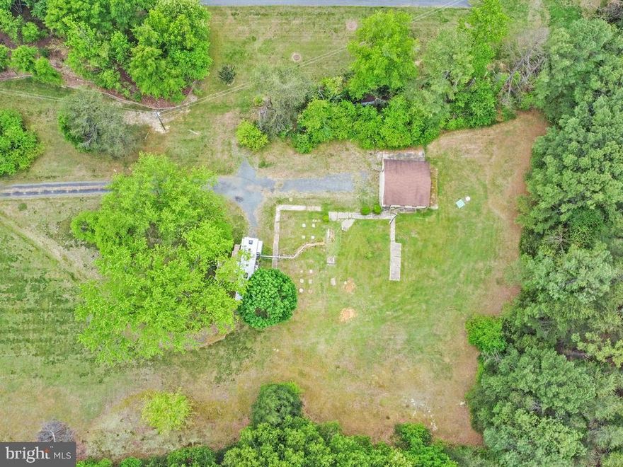 Are you looking for land that is close to the highway but far enough from the noise of the hustle and bustle, then here is your lot. The lot is fairly level and surrounded on the lot lines with mature trees.  It boasts 2.69 acres.  NO HOA FEES bring your own builder or custom build your own potentially, but also don't forget it already has a detached slab garage in place. Come get you land that will serve you in the best ways from an easy commute, peace and quiet, to having restaurants and entertainment within a 5-minute drive. Lot lines on pictures are a very rough estimate.