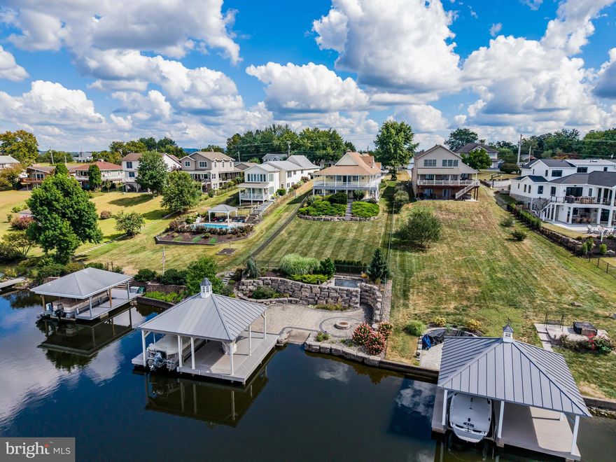 This is NOT just a home, it’s a lifestyle waiting for you to embrace. Welcome to lakefront living at Lake Meade, a private gated community surrounding a 300 acre man-made lake with 5.84 miles of shoreline.  This beautifully renovated 5-bedroom, 2.5-bath house offers the perfect blend of luxury and comfort, with vaulted ceilings that create a bright and open atmosphere. The heart of the home is the custom kitchen, featuring stainless steel appliances and stylish finishes, ideal for entertaining!. Retreat to the main level primary suite, complete with a cozy see-through gas fireplace and spacious walk-in closet. 4additional bedrooms provide ample space for family or out of town visitors! Step outside to discover a tranquil outdoor paradise, featuring covered composite decking, extensive hardscaping, and a private hot tub for relaxation. Enjoy direct access to the serene lakefront, complete with a boat dock and boathouse equipped with a lift, perfect for boating enthusiasts. Recent 2017 updates include new hardwood floors, custom kitchen, updated bathrooms, new shore wall, patio, dock, boat house and new HVAC! Lake Meade Community amenities include 10 Lakeside Recreation areas; 50x82 community pool area with slide; Community Center which includes HOA offices, large conference room, multi-purpose room and lounge;  Sports Complex and Pavilion, basketball, pickleball and tennis courts, sand volleyball courts, soccer field; and  marina complex with 2 launch ramps and informal eatery. Lake Meade is located in Adams County near Gettysburg and and easy driving distance to Harrisburg, Baltimore, Philadelphia and Washington DC. A Realtor MUST be with you to visit the community.  Call us for a tour!