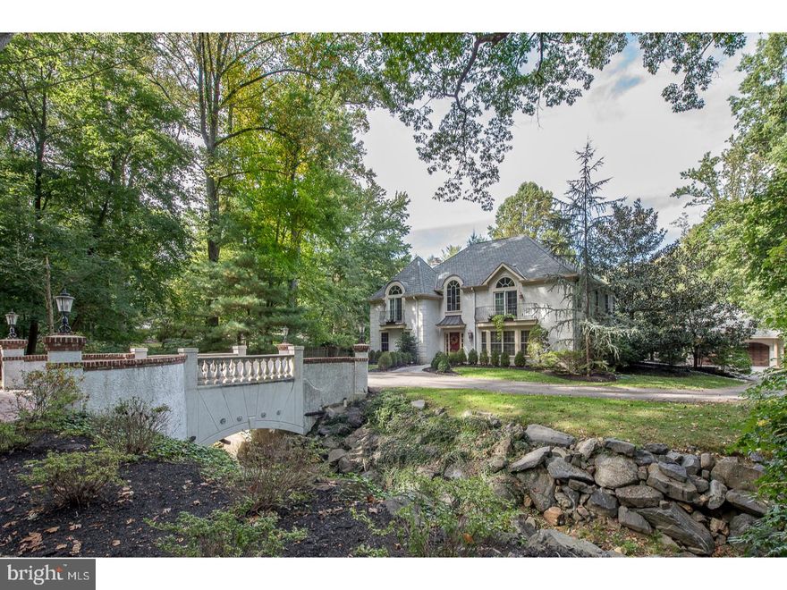 Enchantment reigns supreme in this beautifully situated French Country home on Haverford's coveted Rose Lane. Cross the storybook bridge to your own enclave of serenity and privacy with a flat acre + of land allowing for multiple possibilities and play areas! Drive around to the generous 3 car garage with custom built-ins, providing organization and unlimited storage space on both the first and second floor. The unique layout continues inside this home with an open floor plan, blending architectural elements that create both cozy spaces and soaring ceilings with strategically placed French doors and windows. A 2 story marble foyer with Palladium window opens into every first floor room, while providing spaces for relaxing family time as well as welcoming guests for more celebratory gatherings. The gracious living room is perfect for a Babygrand and is enhanced by columns and deep moldings, while the family sized dining room will accommodate holiday gatherings. The kitchen is a cook's delight with 2 sinks, endless cherry cabinets, expansive granite counters, pantry and an oversized breakfast room with 2 walls of windows overlooking the patio and yard. A convenient mud room off the kitchen makes life easy for young ones and 4 footed friends alike! A cozy TV room with gas fireplace & custom built-ins opens to a vaulted light-filled Family room with French doors leading to the patio. A library/office has generous custom shelving and cabinetry and is tucked away for a private and generous work space. Beautiful hardwood floors, curved archways and architectural details make this home truly "one of a kind." Upstairs the spacious master bedroom with gas fireplace, tray ceiling and French balcony provides a lovely retreat complete with a luxury marble bath and walk in closet. There are 3 more generous bedrooms, one ensuite and a full size laundry room. The partial basement has work out area and GENERATOR completing a manageable yet unique and comfortable space to call home!