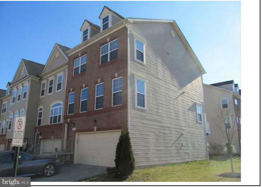 Excellent 3 level Brick front End Unit  Town home with 3 bedroom,2 Full Bath,2 half bath & 2-car garage,Huge deck,2250 sq feet of living space.Kitchen includes granite counters, maple cabinetry & stainless steel appliances.Hardwood floors on entire main living level. Large master Bedroom with ceramic bath features dual vanities,granite and large walk-in shower.Convenient laundry on bedroom level.