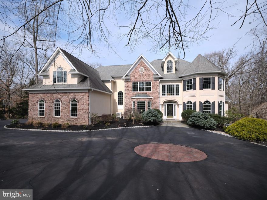 OPEN HOUSE CANCELED Welcome to 205 Burkdale Court. This magnificent custom home was built by well-known builder Dick Doyle. This home boasts 6595 square feet of living plus a finished 3rd floor bonus room with electric fireplace and a finished basement with gas fireplace and tons of storage. Kingswoods Ridge is a premier neighborhood in Solebury minutes from downtown New Hope. The convenience of a home of this magnitude to town, grocery shopping, and entertainment is unparalleled. The first floor features a formal living room and dining room, a recently update kitchen with new appliances and white quartz counter, butlers pantry, a gas stove, two skylights, two dishwashers and an island that seats 6 very comfortably. The breakfast room is extended and full of windows to overlook your 3.76 acres. Off the breakfast room is a huge new back Trex deck with lighting. It has peninsula fireplace that leads you to the cathedral ceiling family room. The family room has all the millwork you could dream of around the huge windows. Facing west, the entire back of the house gets illuminated with natural light. Also on the first floor there is a half bath for guests, a study with gorgeous wood built ins and an electric fire place. The study has an en suite bathroom that also has a door to the rear mudroom. Up the one of the two staircases to the second floor, your breath will be taken away by the grand hallway that over looks the entry and family room, leading you to master suite and 4 additional oversized bedrooms with large windows. The master suite has a beautifully lit coved ceiling, a gas fireplace, two large fully built out walk-in closets. The master bath has recently been updated. Off of the master suite you will also find a bonus room that is being used as a study/ lounge and has custom closets along the side and an electric fireplace. There are two bedrooms with en suite bathrooms and two bedrooms that share a Jack and Jill bathroom. This home also has a second floor laundry room! The basement was recently refreshed with new flooring  and complete with media area with fireplace, gaming area big enough for ping pong and pool table, secondary kitchen for entertaining by the pool, another bedroom and full bathroom also has a mudroom to the backyard with an indoor hot tub. Under the deck there is a newly installed sauna.  There is also a basement laundry for all the pool towels from summer entertaining. Out side is where this home really shines. The front yard is beautifully landscaped with a circular drive and a three car garage. The backyard has a stunning 45 foot by 22 foot heated pool with automatic cover and sun all afternoon. A huge new Trex deck that run the width of the house and plenty of patio for entertaining. New pathways, fencing, landscaping and and lighting have been installed by the current owners. There is also a whole house generator.