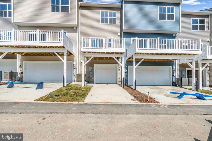 This town home located at Redclover community in the heart of Ranson, WV! The Lancaster floor plan by Lennar. This 3-level townhome boasts a rear-load 2-car garage, and additional recroom with full bath on entry level! The second level is host to an open concept floorplan that seamlessly connects a Great Room, dining area and a rear modern kitchen which features beautiful granite countertops and Frigidaire stainless steel appliances, with 9' feet ceilings and Enhanced Vinyl Plank flooring throughout the main level. The beautiful kitchen is complete with White Ornamental Granite countertops and Barnett Duraform - Stone cabinets. Included on the top floor, there are two bedrooms, including the luxurious owner's suite, which offers residents a restful bedroom, spa-inspired bathroom and generous walk-in closet. A full bathroom is easily accessible from the secondary bedroom and much more in this low-maintenance living home! Enjoy outdoor living with this beautiful 10X12 deck! Washer and Dryer included with this home! Redclover community features onsite amenities such as a tot lot, basketball court, and future community pool, civic park and trails! Commuters will appreciate easy access to the bustling Northern Virginia, Baltimore-Washington, D.C. area. Walkable distance to Commercial stores like Home Depot, Aldi, Mall and Kohls shops