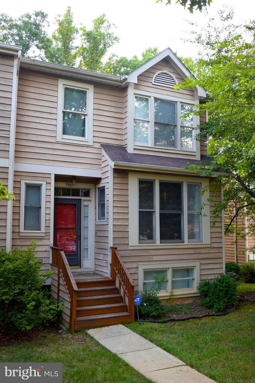 Four bedroom End unit town house! Backs to woods* In-Law Suite in lower level * Large eat-in kitchen with tile floors and triple bay window * Hardwood in Dining Room & foyer * Living Room with warm fireplace and french doors to huge deck * Master bedroom with vaulted ceiling * Owner says SELL! Bring all offers!