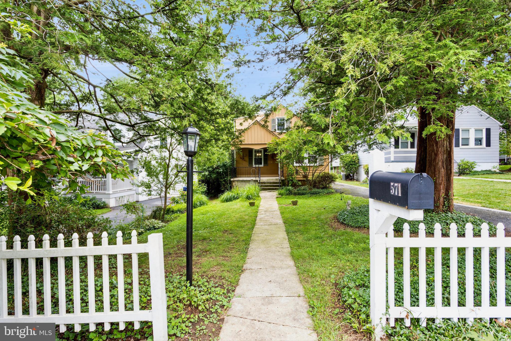 “Location, Location, Location”
Situated on a quiet street in highly sought-after West Towson, come walk through the white picket fence and experience this charming 4-bedroom, 2 bath home. This residence offers numerous prized features including: handsome hardwood floors in the Living Room, Dining Room, halls and all four bedrooms. The adjoined Living and Dining Rooms are perfect for entertaining and include a built-in window seat and a very distinctive arched opening. There are not one but two bedrooms on the first floor. Either of which could easily be repurposed into a Den, Office or Playroom if desired. The Kitchen adds granite tops with an under mount sink, a satin nickel pull-down faucet & track lighting. There is also a KitchenAid stainless dishwasher along with a Whirlpool stainless side by side refrigerator with ice and water through the door and a gas self-cleaning range with a griddle. Step out of the Kitchen into a roomy Sun Room which was added by the long-time owners, featuring nine windows, a vaulted wainscoted ceiling and dual fans. This is a wonderful place to relax and read a good book or admire nature. Upstairs there are two additional bedrooms including the generous & bright Primary Bedroom with two closets and four windows. The 2nd bedroom can also easily be repurposed if you prefer. There is an operational skylight in the upper hall that can be opened to let the fresh air in. There are also two very handy, large walk-in attic storage areas. The wide-open basement has four windows and houses the washer, dryer and a laundry sink. There is plenty of space here to finish in the future, if & when you’re ready. For your comfort and convenience, there is natural gas heat with a programmable thermostat. For your safety there are two new combination smoke/CO detectors. Outside there is much to enjoy in this peaceful setting, starting with a spacious rear deck with synthetic flooring and two sets of steps. The long driveway can accommodate many vehicles. There is a private fenced in backyard with a large storage shed that includes electric power. Hiding in the rear corner of the backyard behind a Fig tree, is a cozy deck with string lights overhead. Don’t overlook the wonderful, traditional covered front porch and the mature plants, trees and shrubbery all around. Recent improvements include, new HVAC equipment, a new sump pump and a new toilet in the first-floor bathroom. All the windows have already been replaced! This home is conveniently close to walking trials, playing fields, shopping, dining & movies in Towson and it is minutes from 695 & 83. Don’t let this one pass you by!