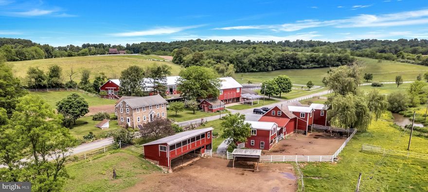 Schocharie Ridge Farm, established in 1984, is a beloved fixture in the local equestrian community. Its owner of 39 years has poured her heart & soul into making this epic 48 preserved acre farm into a vibrant facility. A strong boarding history has kept this business in the $. The large indoor & lighted outdoor rings, 30 acres of spacious pastures w/ a mix of trails are currently enjoyed by 30 boarders.  6” wide vinyl electrified fencing surrounds some paddocks, tape fencing in other turnout areas, coated high tensile fencing in back pastures. 19 box stalls, 3 run-in sheds, a tack building, washing areas, milk house & other buildings (2 of which could possibly be made into an apartment) make up the rest of complex. Clinics & schooling shows have been hosted here. Perfect watering set-up w/ auto-waterers & creek access. No hoses or carrying buckets! Boarding rates are below market & can be improved. Taxes only $6965! A charming 4 bedroom, 2 full bath stone farmhouse serves as the residence. Large eat-in custom kitchen w/ brand new granite counter tops, new cook-top & new stainless-steel sink, oak cabinets & tile floors. Formal dining room has oak floors & built-in authentic concrete safe. Random-width newly refinished floors in living room w/ wood stove & stone hearth. Nice office. Large mudroom was just renovated. Most rooms & some woodwork recently repainted. Floors have either been refinished or new flooring installed. Much of the electric has just been updated & a new oil tank installed. There is a 2-acre lot w/ views included that is un-preserved & could be built upon or sold off separately by new owner with minor subdivision approval. A 9 acre field yields hay.