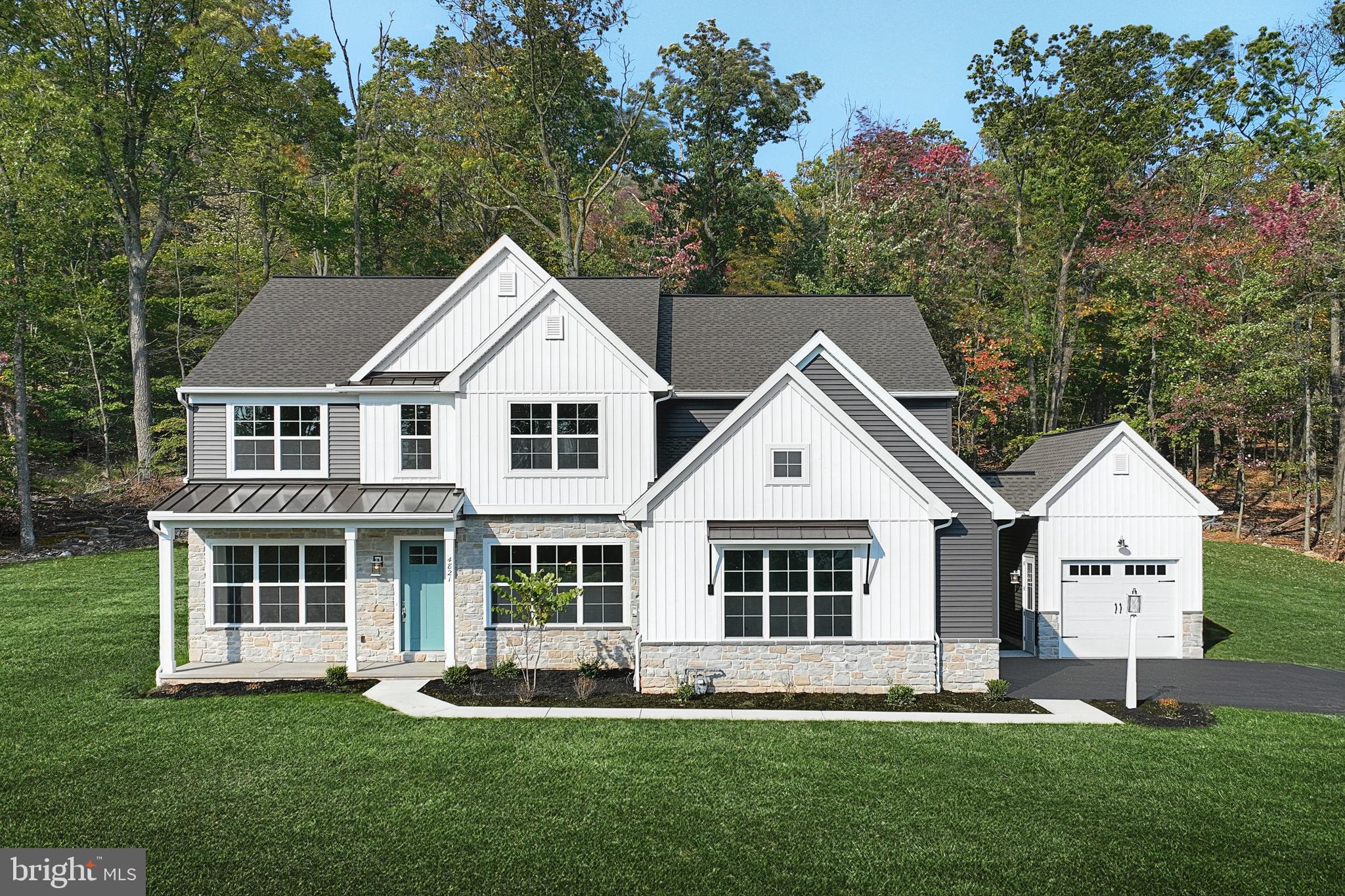 This stately 2-story home has an inviting front porch, 10ft ceilings on the first floor, a 2-car, side-load garage, and a 1-car detached garage with a breezeway that opens to a mudroom. Luxury hardwood flooring flows throughout the main living areas. The formal dining room, accented by craftsman wainscoting, is connected to the kitchen by a butler’s pantry. The well-appointed kitchen features quartz countertops with a tile backsplash, enhanced cabinetry and appliances, and a large center island and pantry. The breakfast area with access to a rear patio opens to the great room warmed by a fireplace with full-height stone surround and a box beam mantel. To the left of the home are a cozy, living room and a carpeted study. On the second floor, the owner’s suite boasts a private bathroom with a double bowl vanity, tile shower, freestanding tub, and an expansive closet. Three additional bedrooms, 2 full bathrooms, a rec room, and a convenient laundry room complete the 2nd floor.