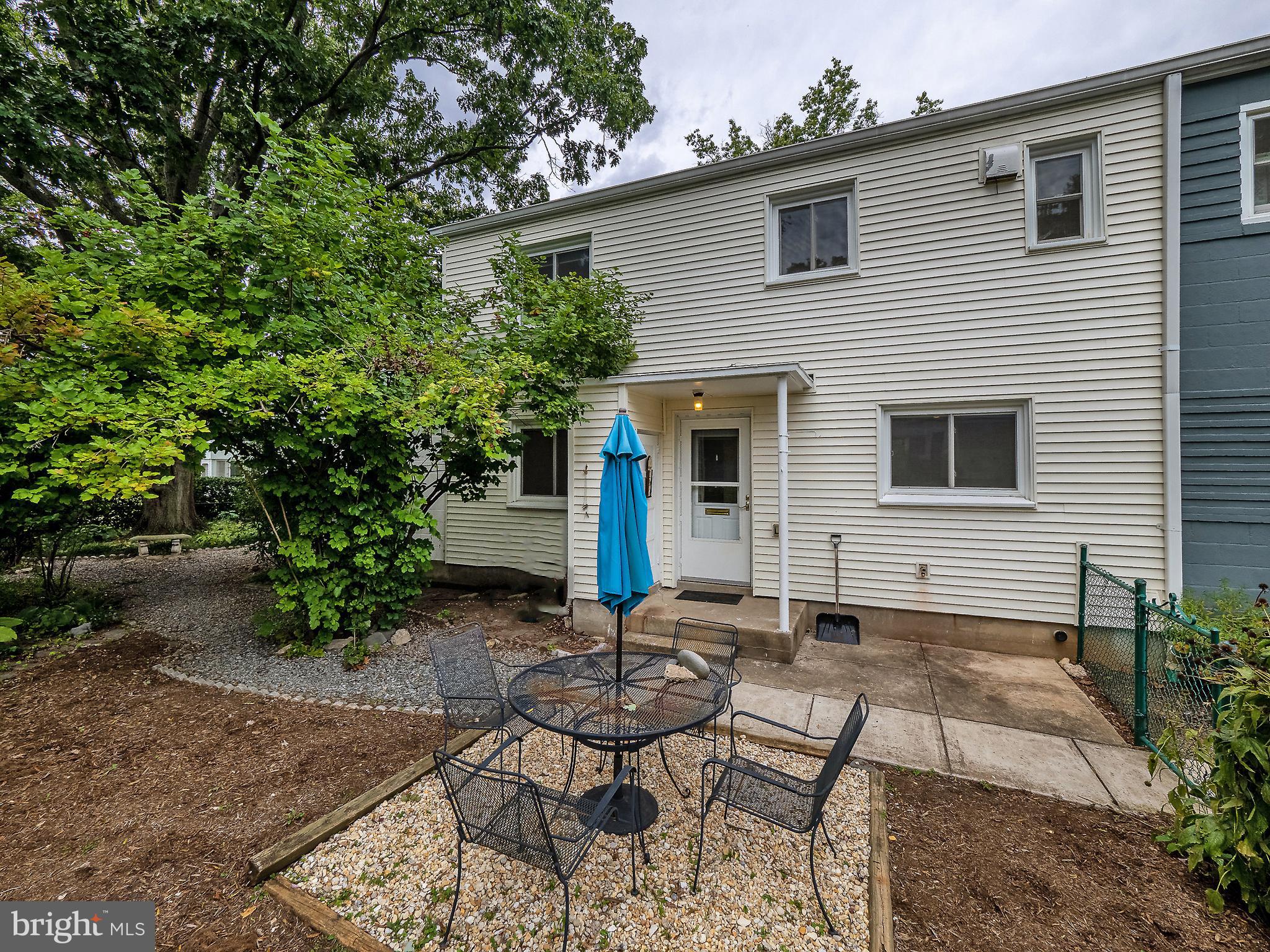 OFFER DEADLINE: Please have any offers in by 4:00 p.m. on Monday, September 26th. Spacious two level end-unit townhome is located on a beautiful corner lot and in a central location across from city hall. You won't believe how central this home is to downtown Old Greenbelt, and yet how private and calm it feels! The floor plan has a separate living room, galley kitchen and formal dining room with new LVP floors in a beautiful natural hardwood style. The kitchen offers upgraded granite countertops and ceramic tile flooring. There is an entry-level half bath and plenty of "under stairway storage." The glassed-in porch will be your favorite spot with views of the shaded yard. When the doors are open it's a breezy, private oasis.
The upper level hosts three bedrooms and a full bath with ceramic tile shower including a seat. The exterior is a sheltered gathering place, a natural extension of the home with a fenced yard, shaded garden, and multiple areas for gathering around all three sides of the home. An attached masonry storage shed provides plenty of space for gardening tools and bike storage.
This is a co-op, see ghi.coop for information about the community. Cash or conventional financing only, with GHI approved lenders. Co-op fee includes PROPERTY TAXES, insurance, and major exterior and interior maintenance.