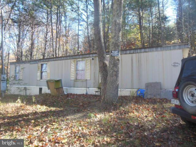 This property has two trailers each have their own address, one is live able and the other needs work, both have electric and septic. This could be great for hunters this subdivision has access to WV State hunting land. Less the one hour from Winchester. OWNER SAYS MUST SELL ANY OFFERS WILL BE CONSIDER