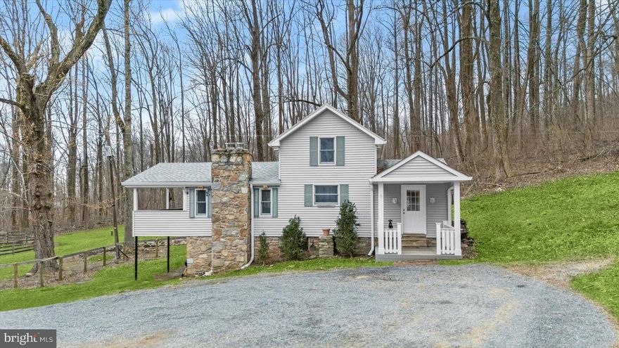 Tucked away among the trees and surrounded by the natural beauty of Western Loudoun’s mountain landscape, this 4.2-acre retreat offers the privacy and tranquility so many buyers are searching for. If you’ve been dreaming of mountain living—where mornings begin with birdsong and evenings end beneath a canopy of stars—this is your opportunity. Set in the scenic hills near the Short Hill Mountain area of Lovettsville, the property feels worlds away from the pace of everyday life while remaining just minutes from the charm of town, historic Hillsboro, and the vibrant shops, dining, and wineries of Purcellville.

Showing beautifully and full of potential, the home offers endless possibilities for its next chapter. Beamed Cathedral ceilings and an open layout welcome you with pride and allow for effortless entertaining. Whether you’re seeking a peaceful full-time residence immersed in nature, a weekend mountain getaway, a place for you and your horses, or even a unique rental or investment opportunity, this property provides the perfect canvas for your vision.

The acreage offers a wonderful blend of wooded privacy and usable space—ideal for equestrian enthusiasts, hobby farmers, outdoor lovers, or anyone craving room to roam. The setting is quiet, secluded, and serene, creating a place where you can truly unplug. The home is being sold as-is, but has been lovingly cared for by its current owner over the years. It’s a fantastic opportunity to personalize, renovate, expand, or simply enjoy as it is while taking in the peaceful surroundings and imagining all that this special property could become. 

Updates include the following: Roof (2024), Septic Distribution Box & Main Line (2022), Electrical Panel Box (electric IS grounded) 2020, Furnace (2024), Thermostat (2025), Electrolux Washer & Dryer (2022), Fencing (2022 & 2025), Flooring ( 2021 & 2025), Paint Throughout (2025), Refrigerator (2022), Basement Insulation (3/2026)