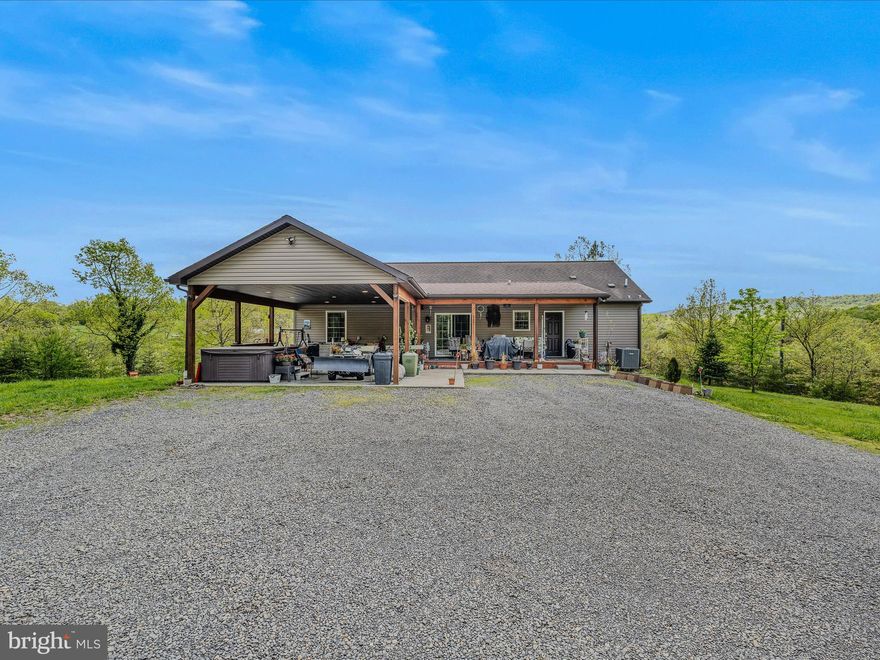 *$2,000 closing cost credit for acceptable offer! This large rancher sits on over 2 acres and incudes a full FINISHED basement. The large driveway provides ample parking for family and guests. There is a covered porch in the front of the home to enjoy your morning coffee while taking in the views. Inside the home your kitchen features stainless steel appliances, raised panel cabinetry and a stainless farmhouse sink. The space also includes a spacious pantry for lots of storage, LVP floors and recessed lighting in addition to the ceiling fan. A peninsula island opens the kitchen to the dining room. The LVP floors carry through. Here you also have a ceiling fan light fixture. The glass paned door provides access to the covered patio. Beyond the dining room you have a large living room with LVP floors and large windows for lots of natural light. Down the hall you have two generously sized bedrooms with carpet and ample closet storage. The hall bath features easy-care vinyl floors, a 3 ft single bowl vanity, and a 5 ft acrylic tub/shower combo. The large primary bedroom measures 12 ft x 14 ft. It features carpet floors and a walk-in closet for tons of storage. The bedroom is located on the rear of the home for beautiful views. The primary bathroom is an oasis. You have a 6 ft double bowl vanity, 5 ft oval soaking tub, and a 5 ft acrylic shower with glass doors. A separate water closet provides extra privacy. The lower level of the home is finished. Large rec room features beautiful tongue and groove pine ceilings. You have an Osbourne woodstove. Tons of windows provide natural light and the option to use as bedrooms if desired. There is recessed lighting throughout and a rough-in for a future full bath. There are so many options for this space. You also have your laundry/utility room on this level. It presents houses the washer, dryer, freezer, water heater and shelving for storage. Outside the home you have 2 beautiful acres to enjoy. There is an 8 ft x 16 ft deck off of the living room. It's a great place to take in the mountain view. You have a 24 ft round pool with deck leading to the lower-level rec room and up to the carport. This will be the place to be this summer! There is a 10 ft x 10 ft shed with a lovely board and batten front. The gas fire pit and pergola are negotiable. This home all of the space you want with beautiful views. Schedule your showing today!