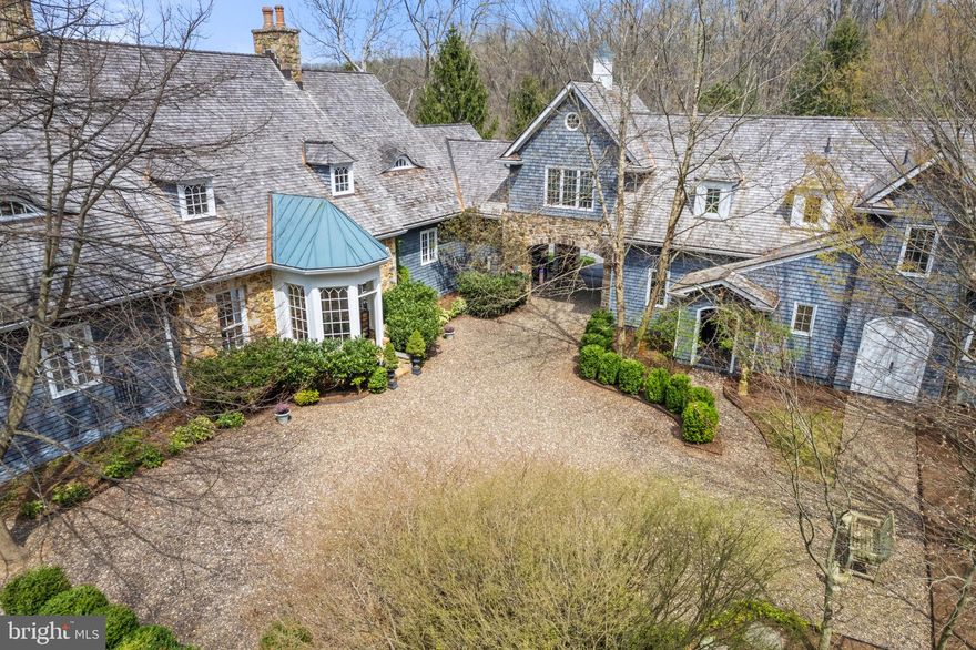 Welcome to Glen Raven, an enchanting custom built home designed by Architect Tom Gilbride. This English Country Manor is  nestled on the side of the Blue Ridge Mountains with stunning Shenandoah Valley and Raven Rock views, conveniently located just off Rt. 7 & minutes from the historic village of Bluemont. 
An extraordinary property with courtyard, owned solar panels, 4 car heated garage, paved drive, porte cochère, antique pine floors, numerous custom accents, 4 fireplaces two wood burning , two gas (one in primary), primary suite with two walk in closets, two separate bathrooms,  balcony with valley views, stunning brick foyer, outdoor entertaining space, and full apartment with private entrance. This property  must be experienced to be appreciated! 
Glen Raven is located close to area hiking and the Appalachian Trail,  the Shenandoah River, local wineries and breweries, and benefits from the Clarke County tax rate.  A spectacular weekend retreat, multi generational use  or year round home. 

 Well positioned  approximately 56 miles to DC, 16 miles to Middleburg, 9 miles to Purcellville,  29 miles to Winchester Va.      Shown by Appointment Only.