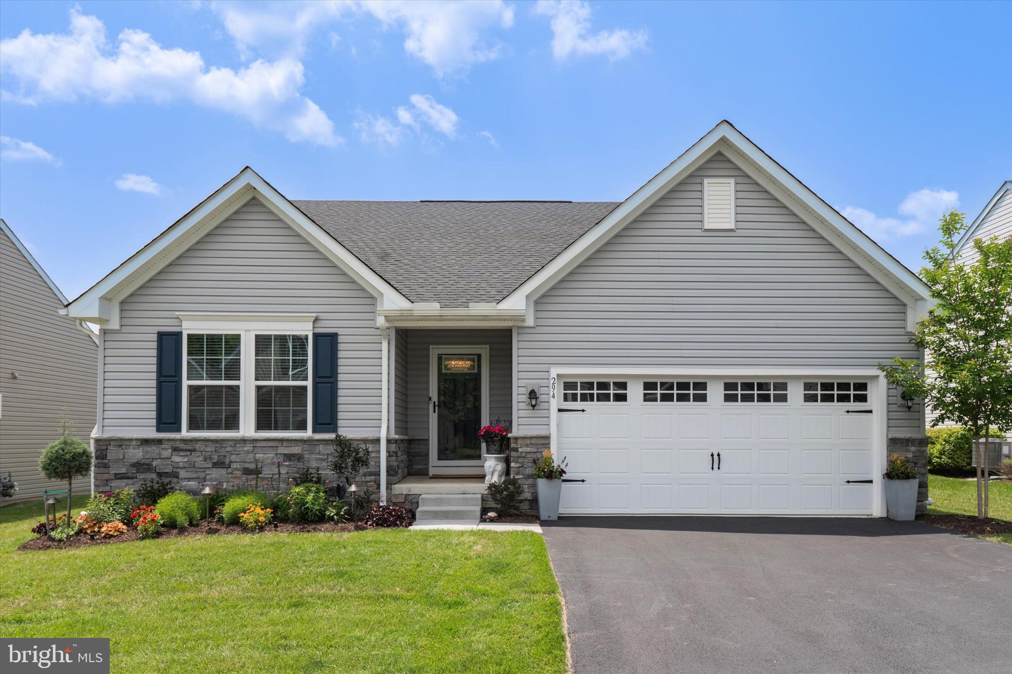Welcome to 294 Letitia Manor Drive in the Big Elk 55+ Community in the picturesque town of West Grove! Built in 2021 (Phase 1, Lot 41), this sought-after Pisa Torre model is better than new construction and filled with upgrades throughout. As you approach, you'll be greeted by professional landscaping and a recently installed sprinkler system. Step inside to a bright and airy entryway featuring a tray ceiling. This leads to a guest bedroom with a ceiling fan, an office with French glass doors (which can also be used as a third bedroom), and a full bathroom with a custom-framed mirror. The impressive great room boasts cathedral ceilings, designer lighting, custom blinds, and a cozy gas fireplace. The open kitchen is a chef's dream, offering white shaker cabinets, granite countertops, under-cabinet lighting, recessed lighting, stainless steel appliances, a tile backsplash, and a large island perfect for entertaining. The morning room, filled with windows and sliders that open to an expansive Trex deck, is the perfect spot to enjoy your morning coffee. The deck, designed and installed by Hines Outdoor Living, features lighted posts and stairs leading to the backyard. The primary suite includes a ceiling fan, custom window treatments, a walk-in closet custom-designed by California Closets, and a full bath with a walk-in shower, double vanity, and an upgraded framed mirror. Additionally, this home offers a full basement perfect for storage, a laundry room with included washer and dryer, and custom shelving, plus a spacious two-car garage. The community amenities include a fitness center, clubhouse, and a seasonal outdoor pool. This ideal location provides wide-open spaces while still being close to modern conveniences like shopping, Starbucks, Giant Grocery, the YMCA, amazing restaurants, Longwood Gardens, and medical facilities. Driving distance to Wilmington and Philadelphia.
This home offers incredible value and is only available due to an out-of-state move!
