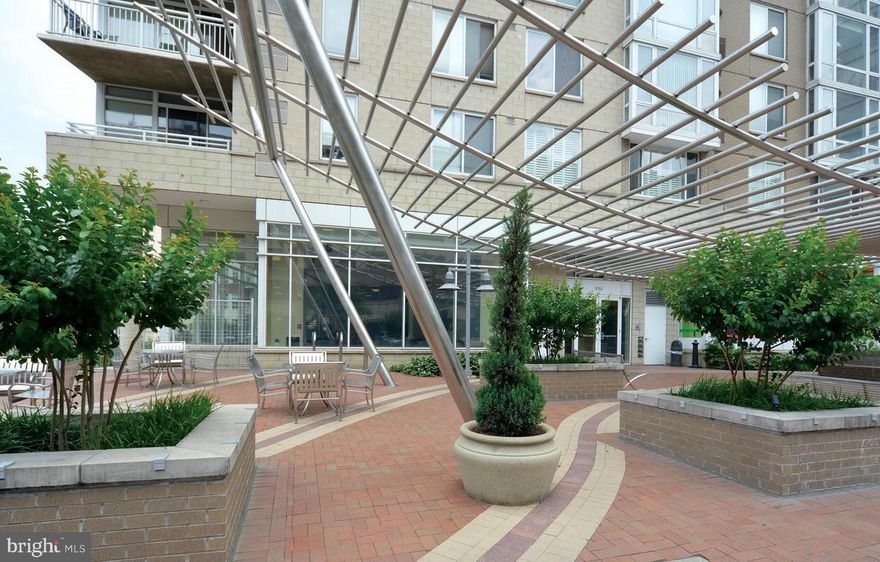 Open House canclled - under contract.  Welcome to the heart of Downtown Silver Spring. This 13th-floor unit offers breathtaking views from the balcony, creating an inviting space to relax and enjoy the cityscape. With a garage parking space and FHA approval, convenience and accessibility are at the forefront. The pet-friendly building features a range of amenities, including a fitness room and a party room in the lobby, outdoor tables/seating, a bike rack, on-site management, and a welcoming community atmosphere. Step inside to discover a spacious living area filled with natural light from the floor-to-ceiling panoramic windows. The gourmet kitchen boasts granite countertops, a breakfast bar, and an open layout that seamlessly connects to the living and dining areas. Hardwood floors run throughout the living area and bedrooms, creating a stylish and low-maintenance living space. The Crescent Condominium's prime location in vibrant Downtown Silver Spring offers an array of dining and shopping options, including Whole Foods, &Pizza, BurgerFi, and El Sapo, all just steps away. Additionally, the Silver Spring Metro, Safeway, Giant, and more are within a few blocks, making daily errands and commutes a breeze. The University of Maryland and Metro bus stop are conveniently located right in front of the building. Don't miss the opportunity to make this vibrant and convenient urban oasis your new home.