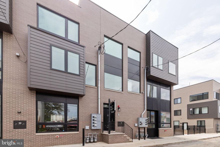 This recently constructed condo features city skyline views and finishes that out-class every other home at this price. Set on a quiet side-street, this two bedroom condo features hardwood floors, recessed lights, and newer finishes in every room. Plumbed island with sink and dishwasher allows for bar seating. Soft-close shaker cabinets, and gas burners make this kitchen a chef's delight. The well-appointed bedrooms offer ample size and custom closets. Enjoy a convenient location that is a few blocks to the beautiful Temple University train station, with every-fifteen-minutes service to Center City, or the Market Frankford Line in the other direction. Too many coffee shops, bars, restaurants, and boutiques to name, and even a couple of grocery stores within a couple blocks. There is no need to rent when you can enjoy a beautiful low-maintenance home, and build equity along with the appreciation of the neighborhood!