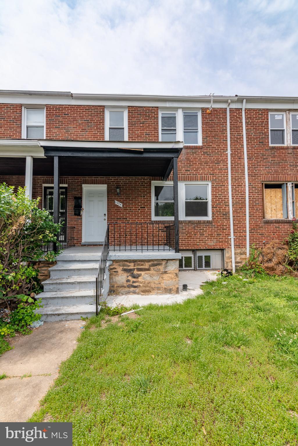 List price to be opening bid at online only auction. Online auction to be conducted on Auctioneers website. Bidding begins Thursday, July 3rd & ends Tuesday, July 8, 2025 at 12:00PM. This updated brick townhouse is configured as two separate residential units and includes a covered front porch, offering flexible living or rental potential. The property is not occupied and is move-in rent ready.
Unit 1 (Main & Lower Level):
• Main level includes living area & 2 bedrooms, all with laminate wood style flooring
• Lower level includes kitchen, dining area & full bath
• Walk-up from lower level to the backyard
• A/C compressor in the backyard
• Forced hot air heating system in lower level
Unit 2 (Upper Level):
• Living Areas: Two bedrooms with laminate flooring
• Kitchen: Laminate wood style flooring
• Bathroom: Full bathroom
• Mini-split A/C unit
Additional Features:
• Separate electric meters for each unit
• Sump pump in lower level
• Separate electric meters & gas meters for each unit
• Potential off street parking on backyard concrete pad
This property in the Berea neighborhood presents a practical investment opportunity or a versatile living arrangement with updated finishes and essential mechanical systems in place. “Berea is situated in East Baltimore, bordered by Sinclair Lane to the south, Milton Avenue to the east, Edison Highway to the west, and Biddle Street to the north. It lies between Broadway East and Orangeville neighborhoods, offering convenient access to major commuter routes.” (Per Wikipedia)