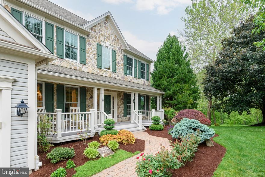 Perfectly positioned on a quiet cul-de-sac in the Woodbrook community and within the highly acclaimed Garnet Valley School District, this exceptional 5-bedroom, 4-bath residence showcases timeless style, thoughtful upgrades, and impeccable maintenance throughout. A stunning gourmet kitchen serves as the heart of the home, featuring soapstone countertops, custom cabinetry, stainless steel appliances, a professional-grade 6-burner range, and beautifully designed gathering spaces ideal for both everyday living and entertaining. Offering over 3,450 square feet of finished living space, the home features a freshly painted neutral palette, designer lighting, custom window treatments and plantation shutters, and a thoughtfully designed mudroom with built-ins.  A two-sided fireplace adds warmth and character—one in the private office with custom built-ins and another in the family room. Upstairs, the primary suite features a tray-ceiling and sitting area. It boasts a stunning upgraded primary bath with premium finishes and expansive walk-in closets that include integrated laundry for exceptional convenience. The beautifully updated hall bath is shared by three additional bedrooms. Additional highlights include a stone front exterior, an expanded front porch, and an IPE hardwood deck offering both beauty and lasting durability. The fully finished lower level includes a bedroom with a full ensuite bath, great room, and utility room, and walk-out access to a spacious paver patio with private views. Ideally located near major routes, shopping, dining, and corporate centers. Just minutes from West Chester, Media, Kennett Square boroughs, Wilmington, and the scenic Brandywine Valley, 10 Edwin Miller Drive offers elevated living in one of Glen Mills’ most desirable neighborhood settings.