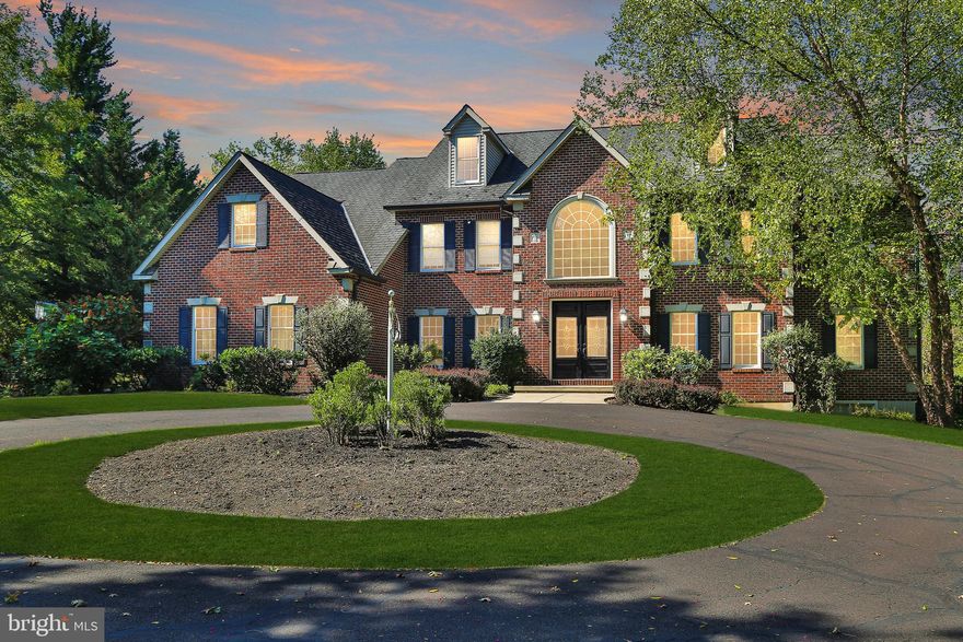 Welcome to a truly exceptional property, offering abundant space and versatility in the sought-after New Britain Township. Nestled in a welcoming private cul-de-sac community, this home combines indoor and outdoor living in an exquisite way, perfect for those who enjoy both entertaining and unwinding. With three stories of living space plus a finished lower level adding 1,300 square feet, this home boasts a total of 7,000 square feet, providing ample room for all your needs.

Here's a glimpse of what this remarkable property has to offer:

This home embodies elegance and convenience, featuring a circular driveway with generous parking. The grand entrance makes a striking impression with a spacious foyer and stately staircase that sets the tone for the entire residence. Enjoy a formal study for work or quiet reflection, a refined living room, and a dining room ideal for hosting. The family room, with a fireplace and picture windows, flows seamlessly to a covered patio, creating an ideal blend of comfort and outdoor charm.

The 2 story, sunlit breakfast area adds warmth to your mornings, while the kitchen, designed with stainless steel appliances, premium finishes, and ample counter space, is the heart of the home. A spacious laundry/mud room adds convenience with a pet-friendly dog bath, making daily routines a breeze.

The luxurious master suite offers a private sitting area and an ensuite bath, while three additional bedrooms, two bathrooms, and a versatile flex room provide space for all your needs. The third-floor bonus room (40'x18') is a rare feature, adding extra dimension and flexibility to the home.

The lower level serves as an entertainment haven with a media room for movie nights, gaming, and relaxation. Additionally, an exercise room, sauna, and full bathroom create a personal wellness retreat. The lower-level family room, with outdoor access, enhances versatility and convenience.

Outdoors, this property shines with over two acres of lush land, an inviting inground pool, and a relaxing covered porch, making it the ultimate space for both leisure and expansion. Schedule your appointment today before this one is gone!